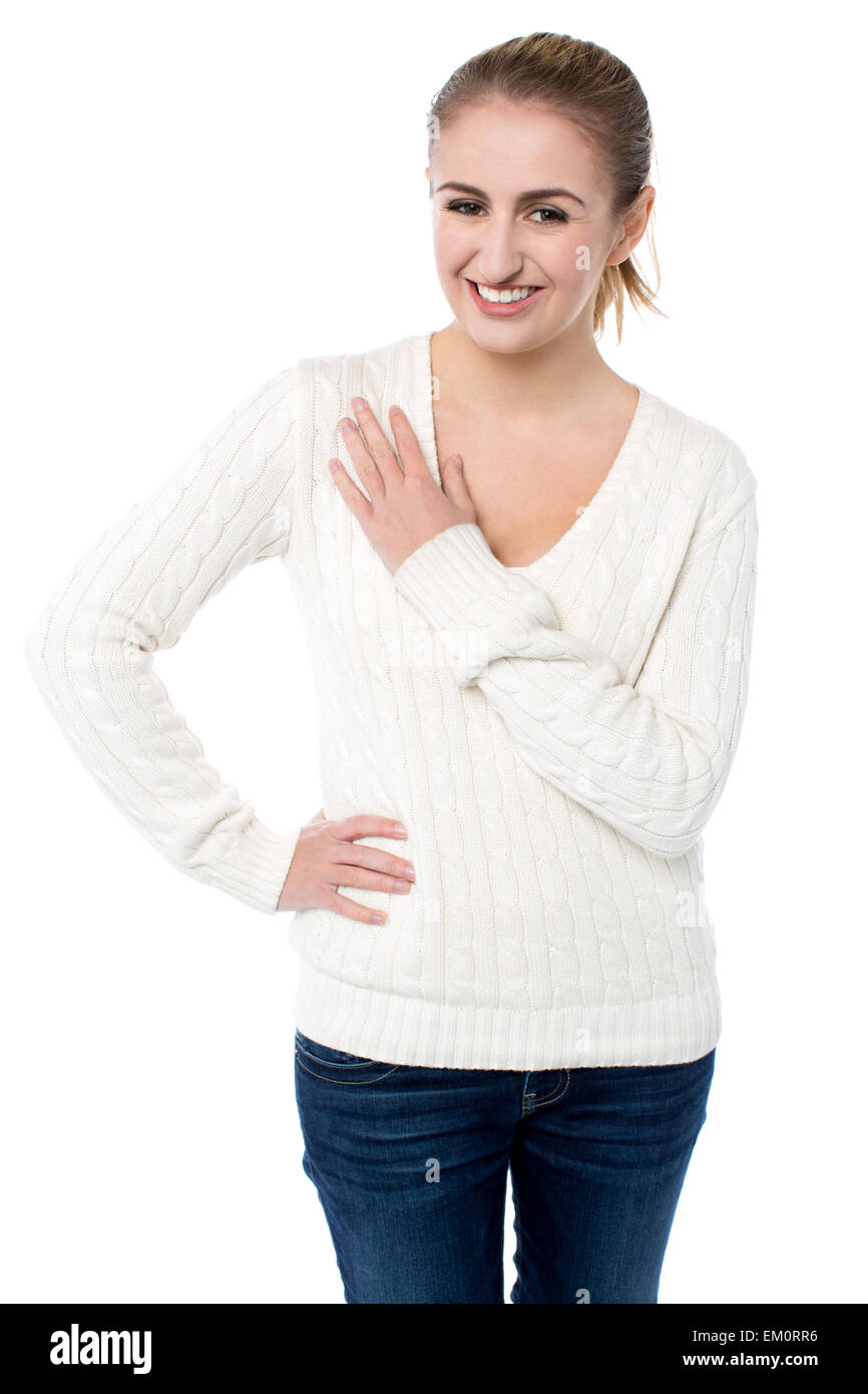 Attractive girl resting arm across her chest Stock Photo Alamy
