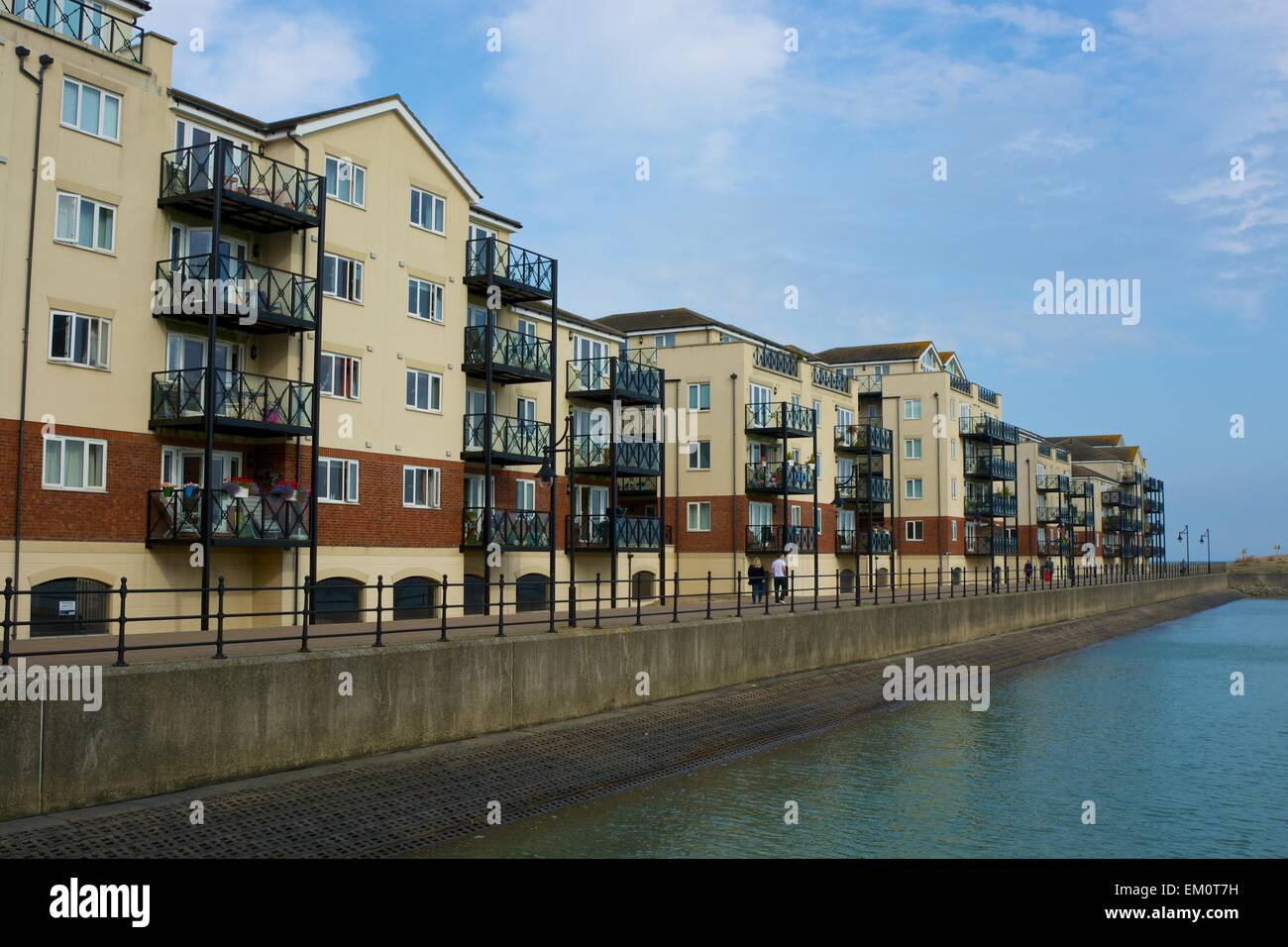 Sovereign Harbour at Eastbourne, East Sussex, England. Apartment buildings and people walking