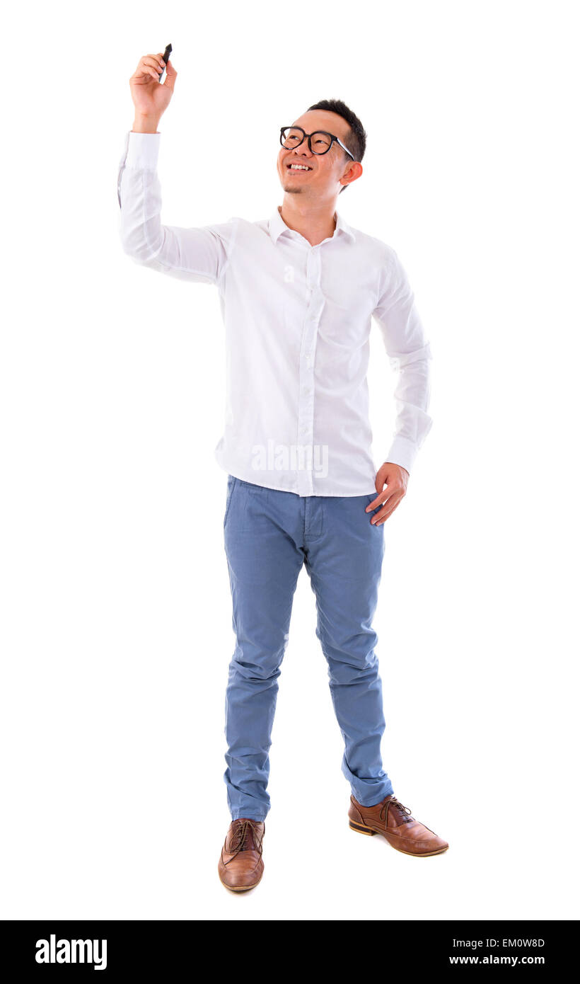 Asian male writing something on glass board Stock Photo - Alamy