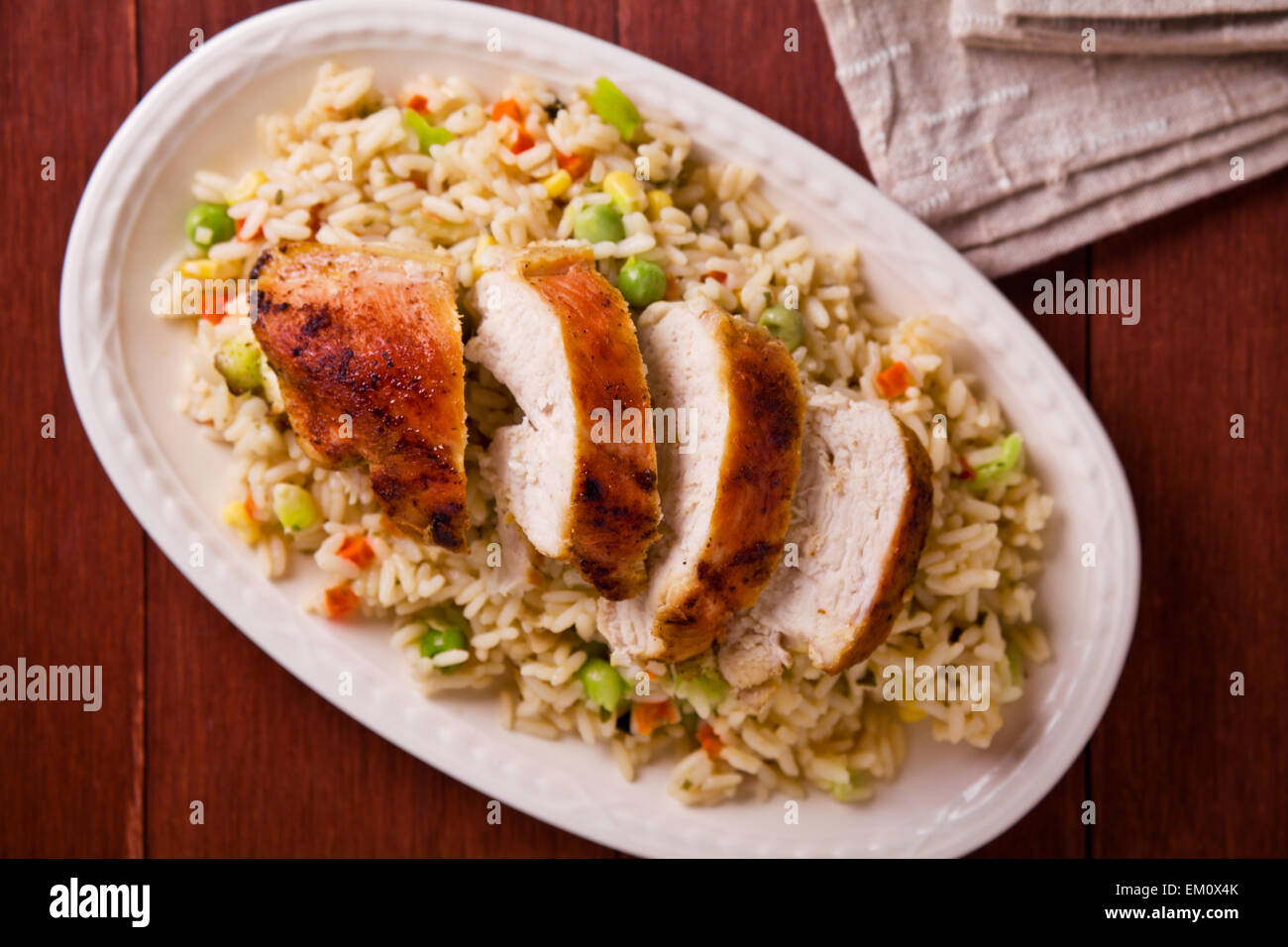 Close up photograph of a meal of chicken and rice with vegetables Stock ...