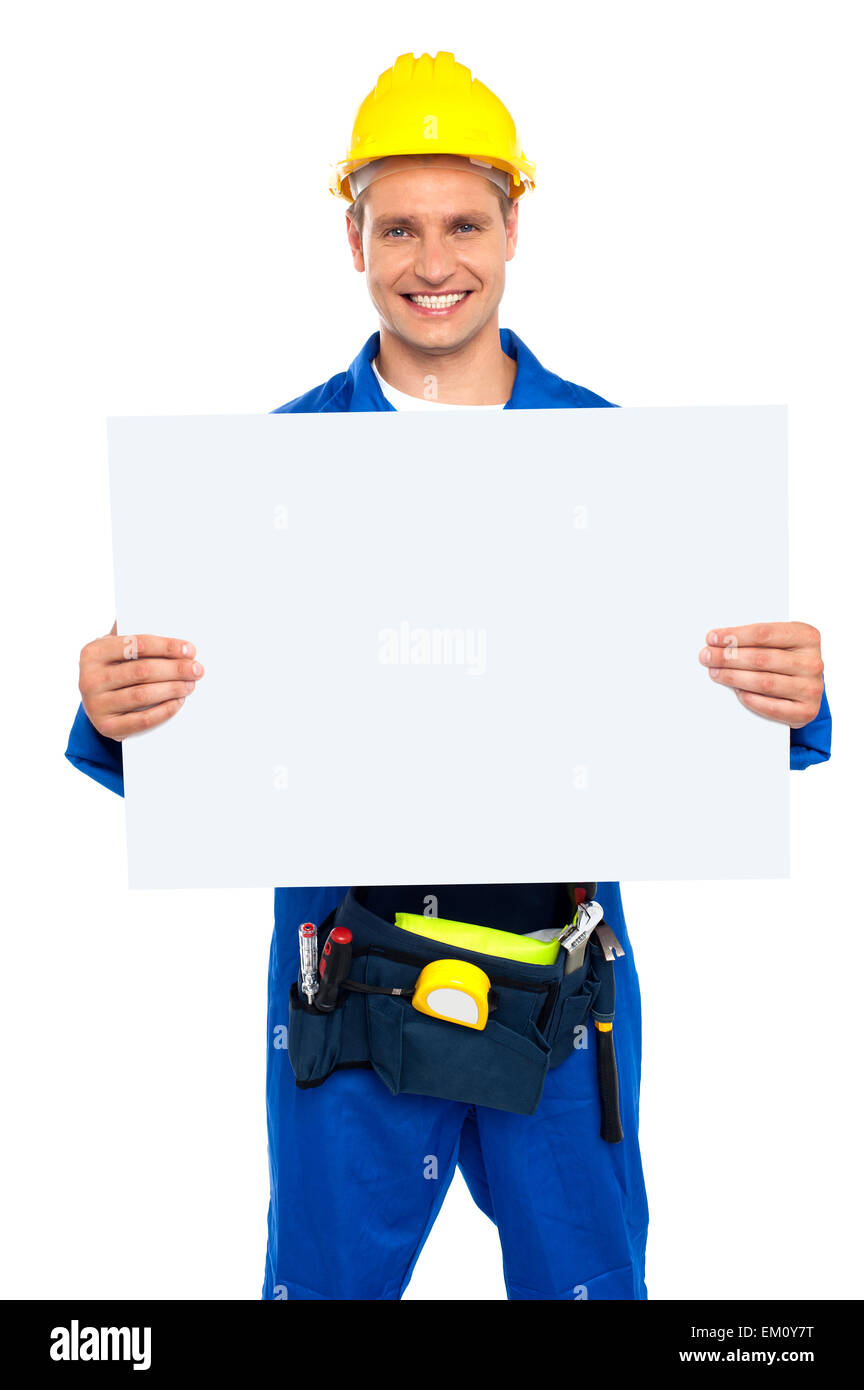 Construction worker holding blank billboard Stock Photo