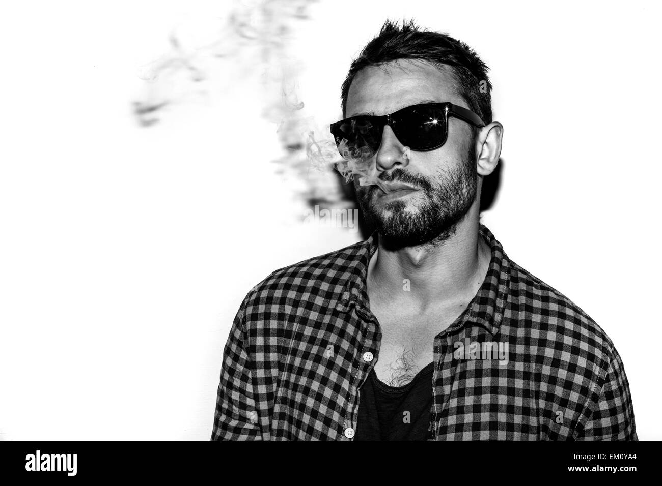 man smoking cigarette black and white portrait Stock Photo