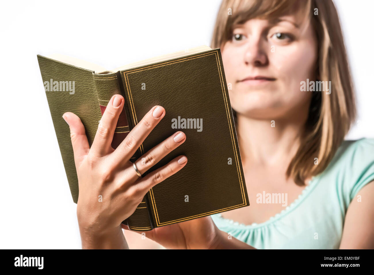 Young girl holding a book Stock Photo Alamy