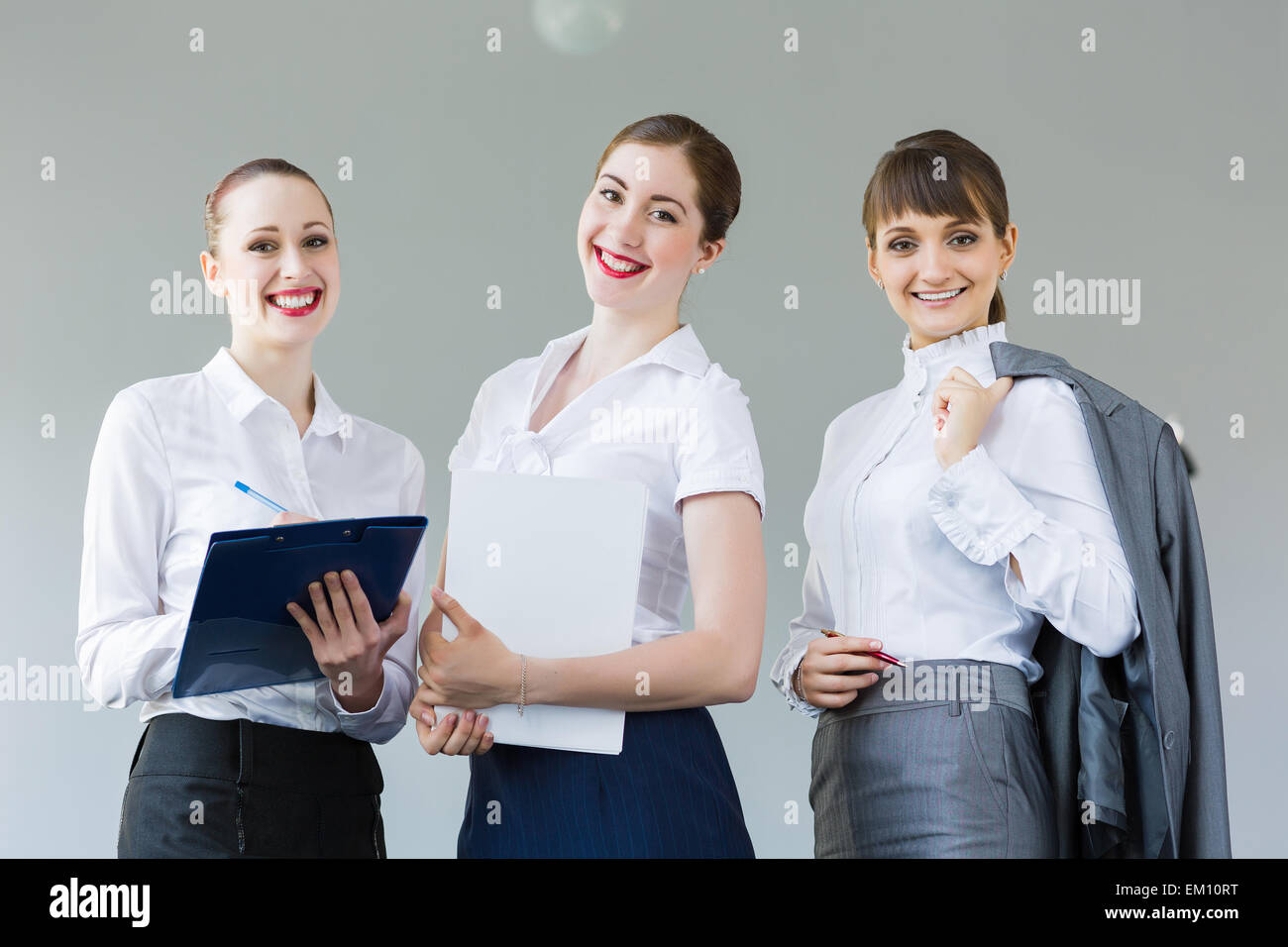 Three young businesswomen Stock Photo - Alamy