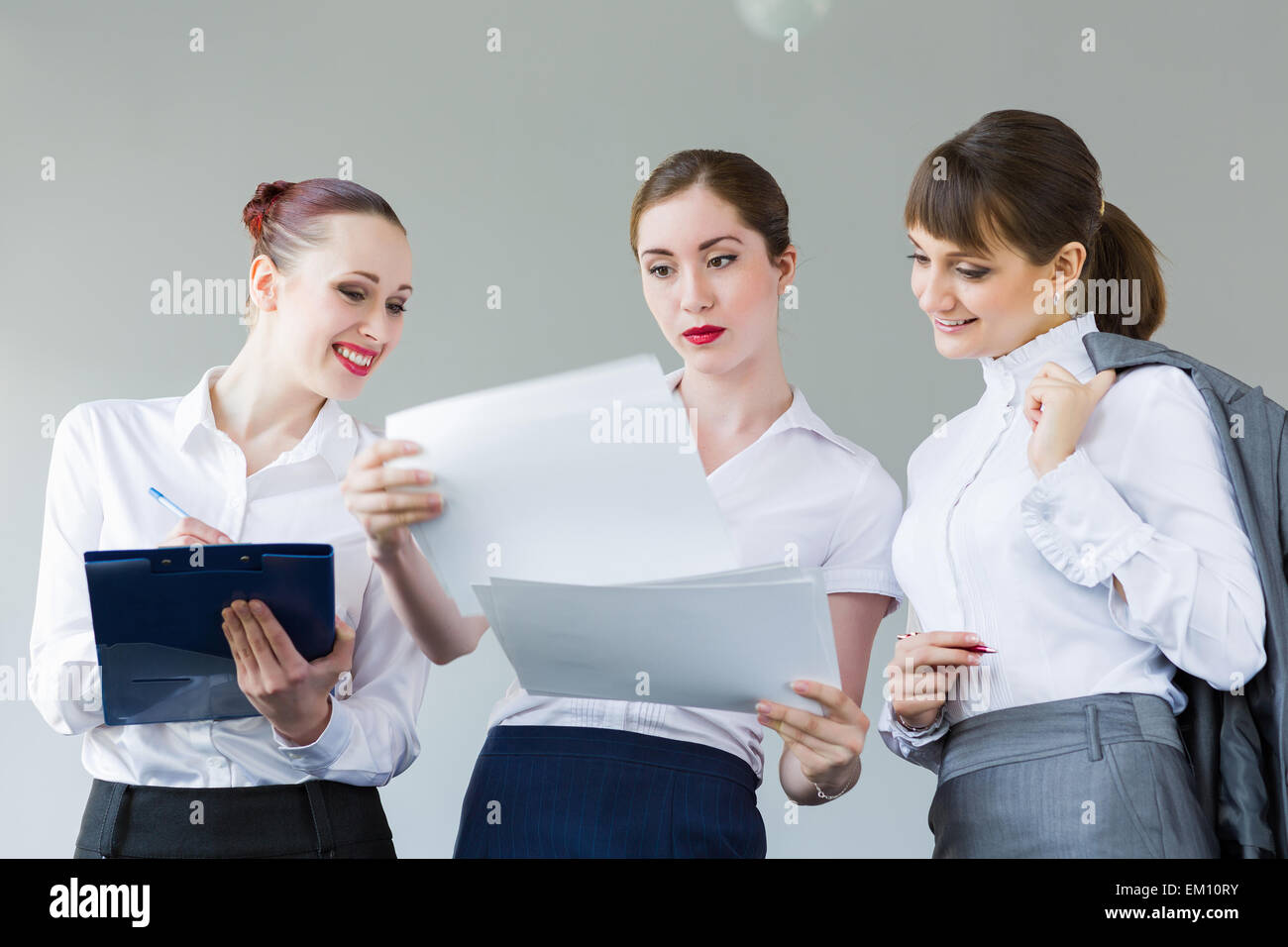 Three young businesswomen Stock Photo - Alamy