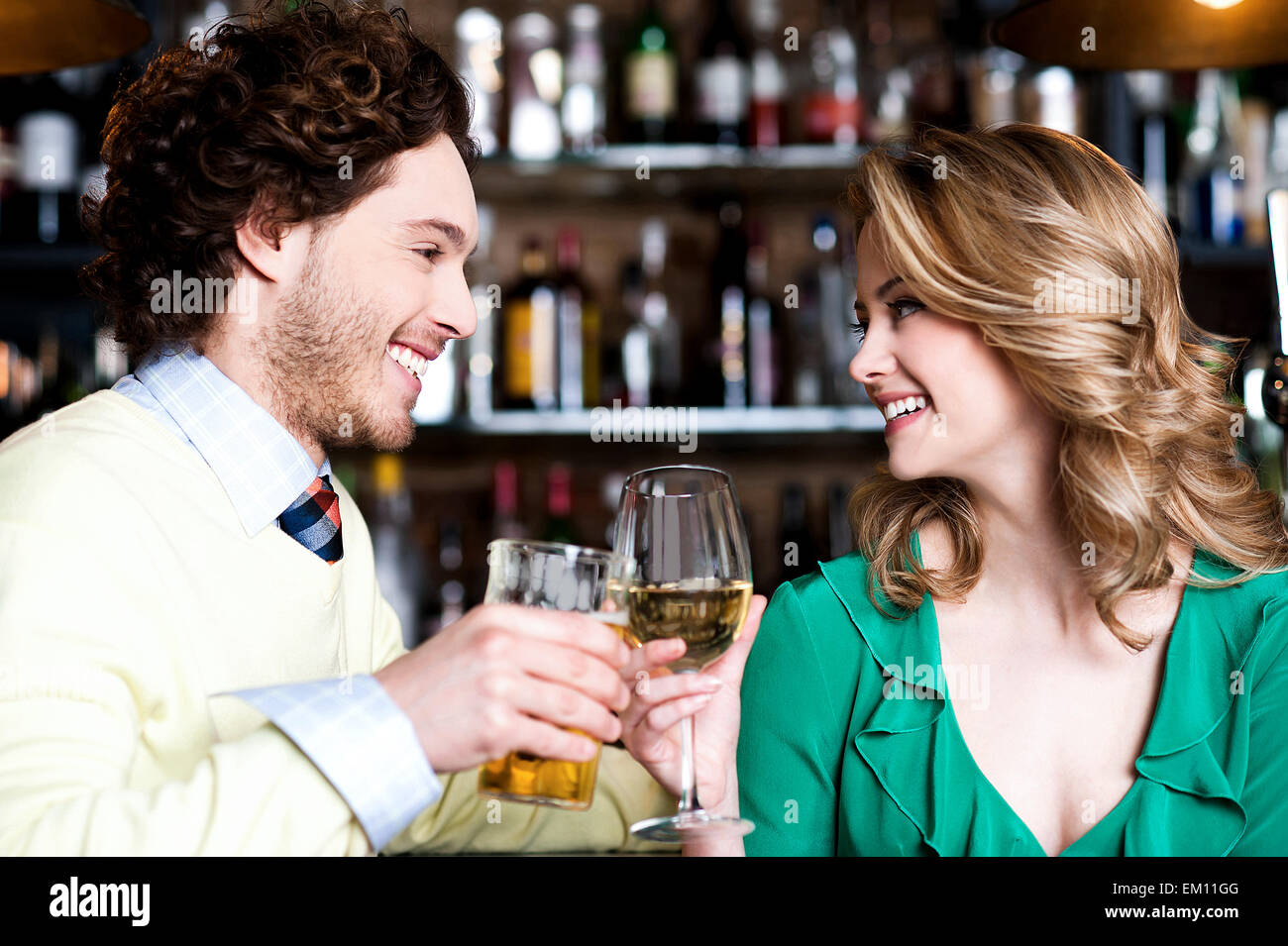Couples enjoying drinks in Stock Photo Alamy