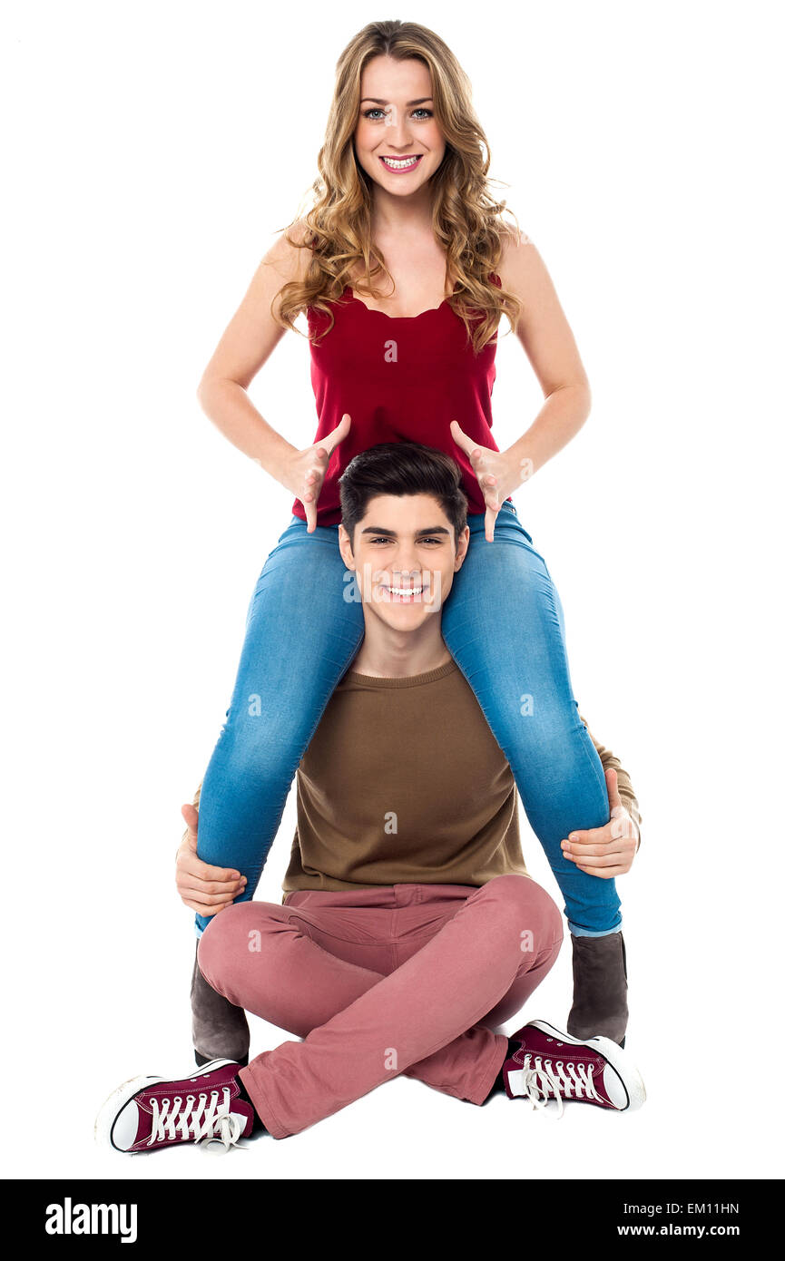 girl sitting on her boyfriend's shoulder Stock Photo Alamy