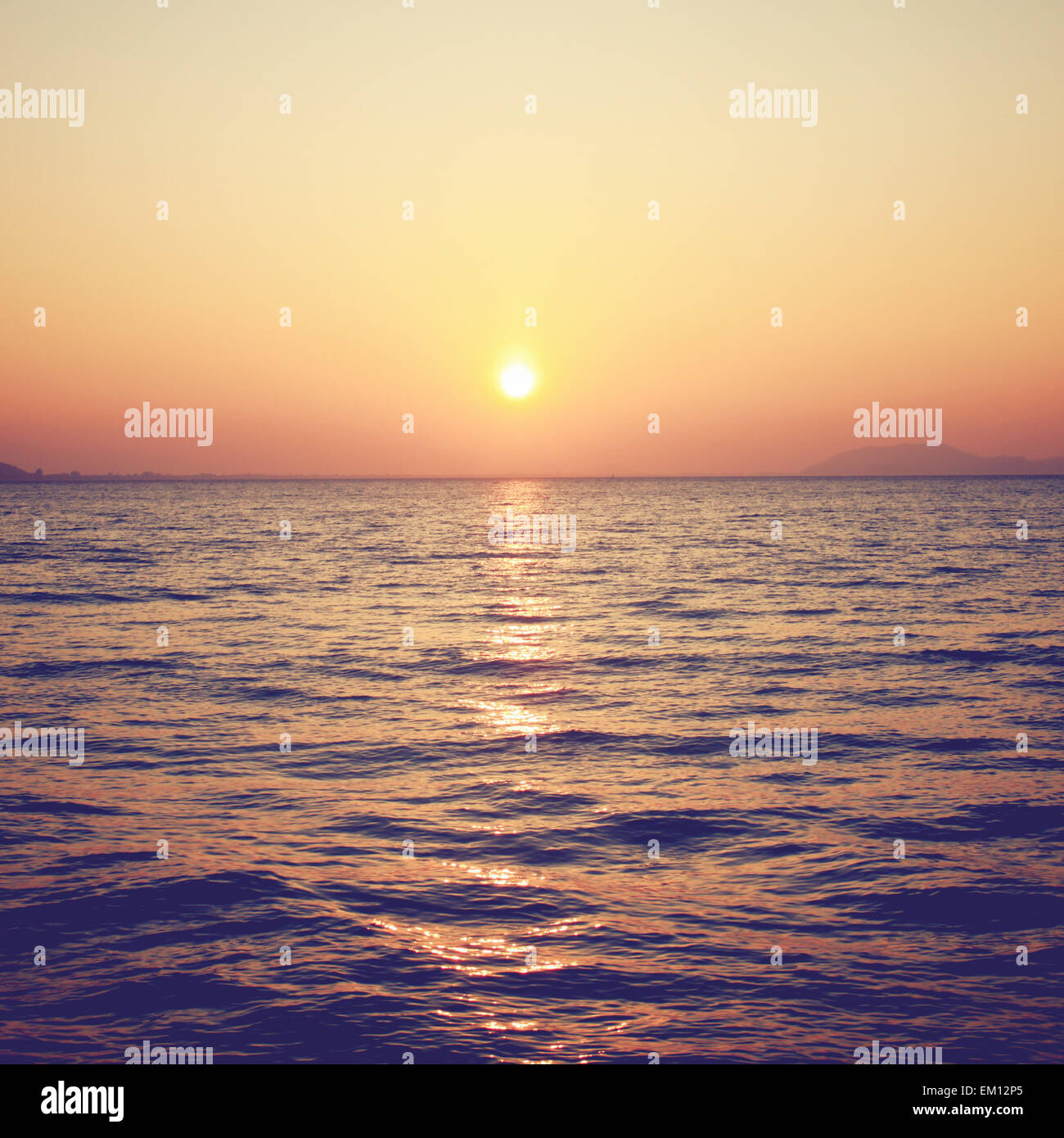 Beautiful sunrise over the sea with retro filter effect Stock Photo Alamy