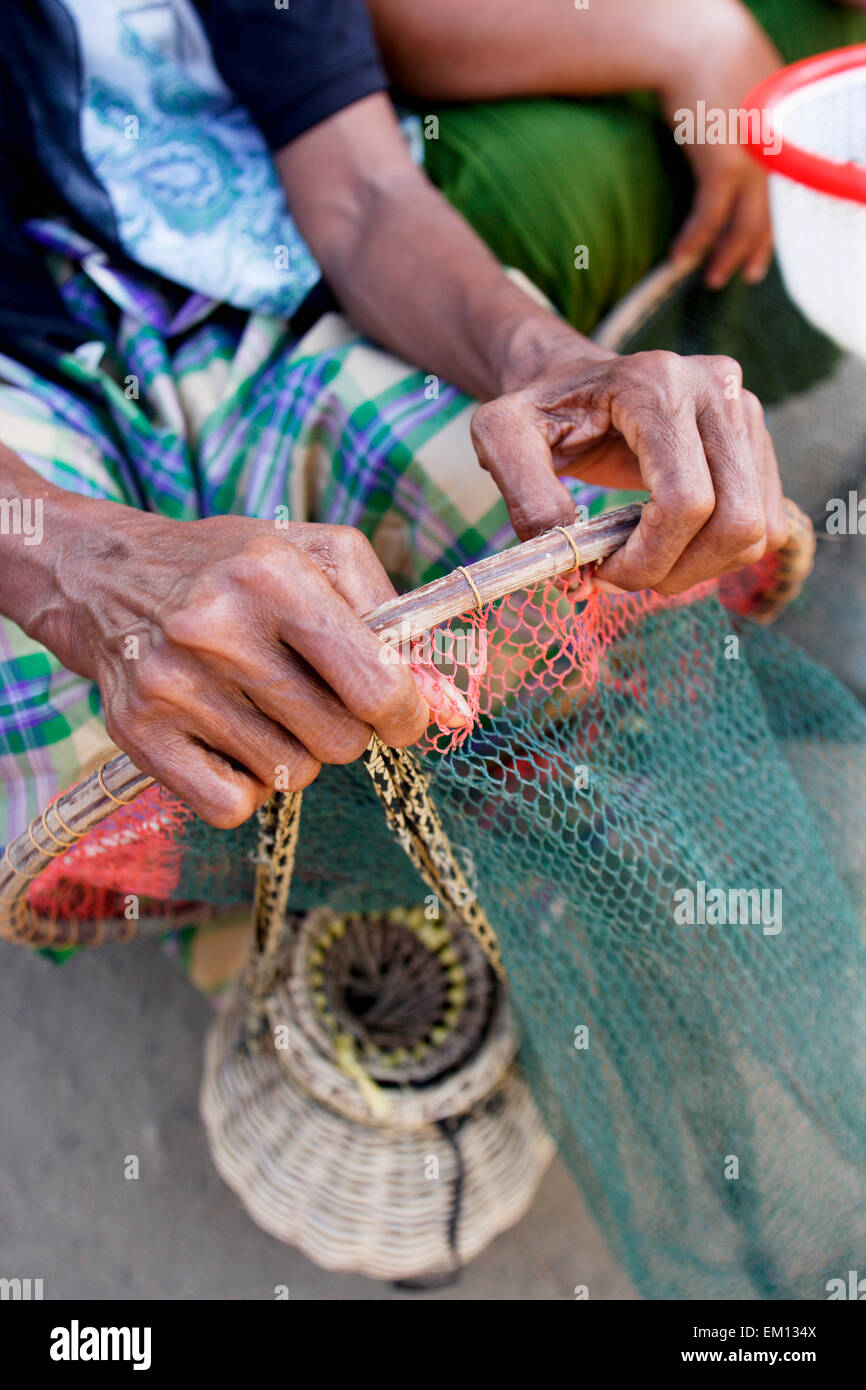 Fisherwoman with the baskets they use to catch prawns; Aceh Province, Sumatra, Indonesia Stock Photo