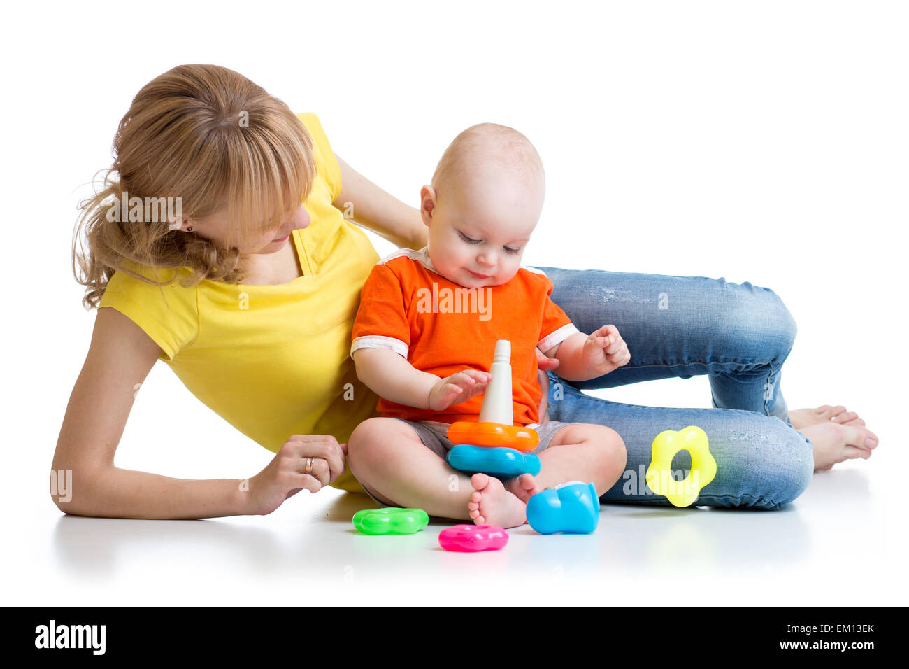 kid boy and mother play together with pyramid toy Stock Photo