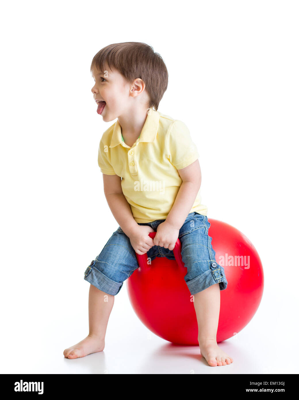 happy child jumping on bouncing ball Stock Photo - Alamy