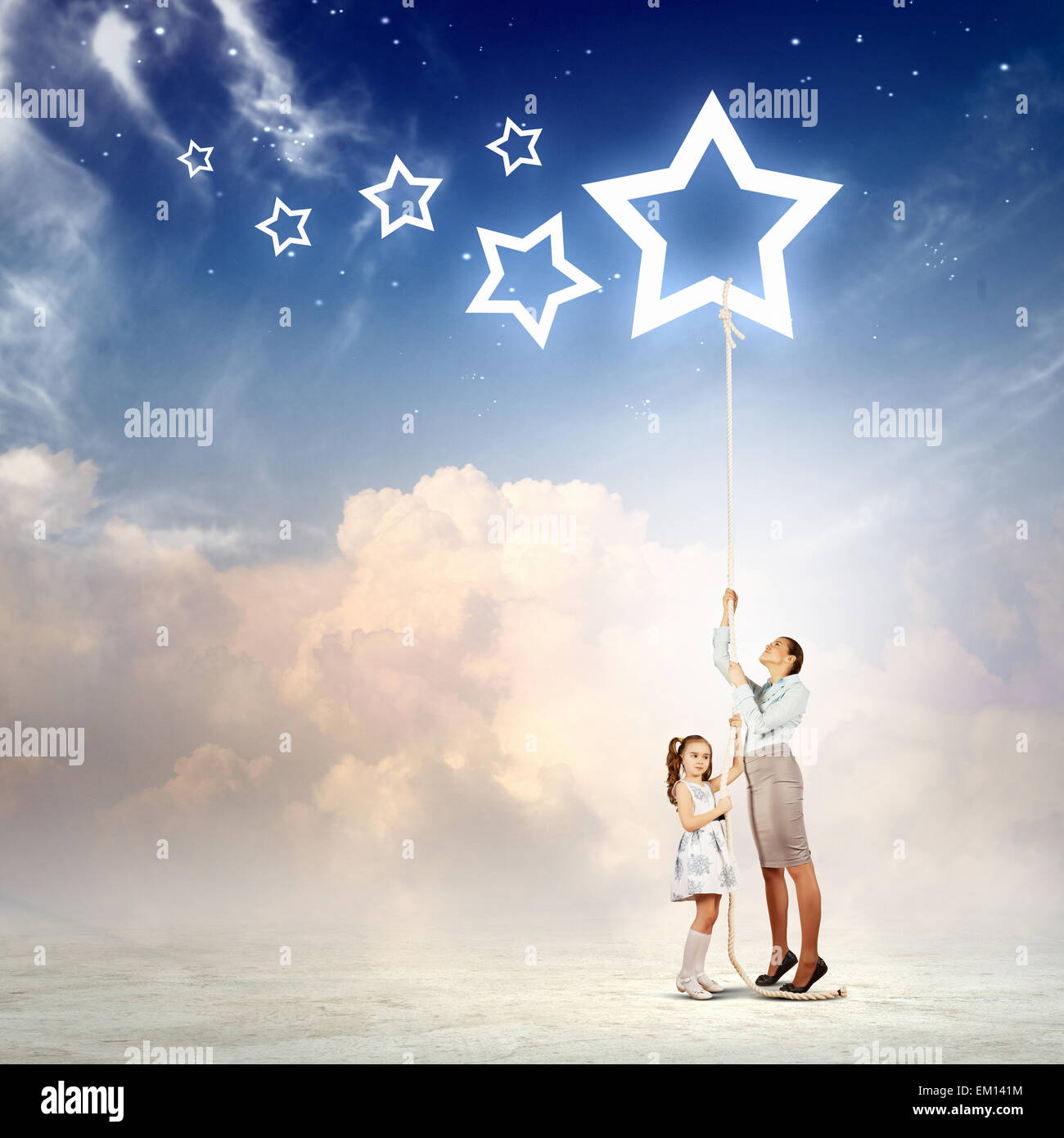 Family pulling rope with a star symbol Stock Photo - Alamy