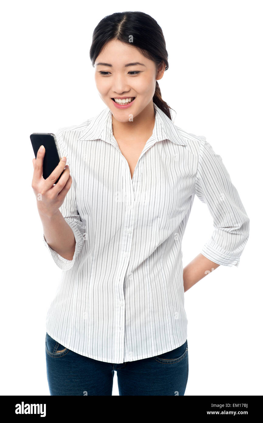 Young girl reading text messages Stock Photo - Alamy