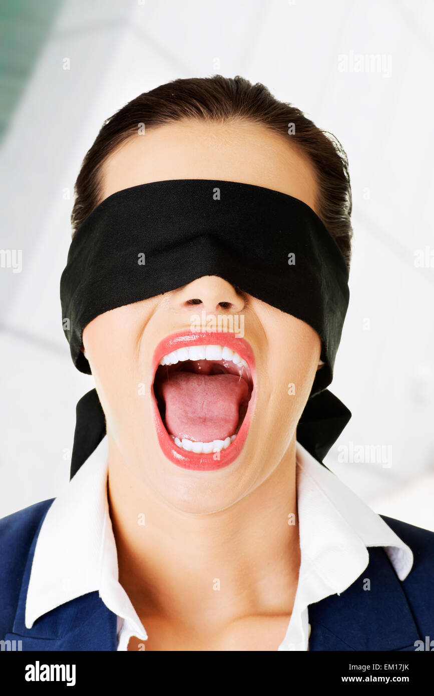 Beautiful frighten young blindfold woman Stock Photo