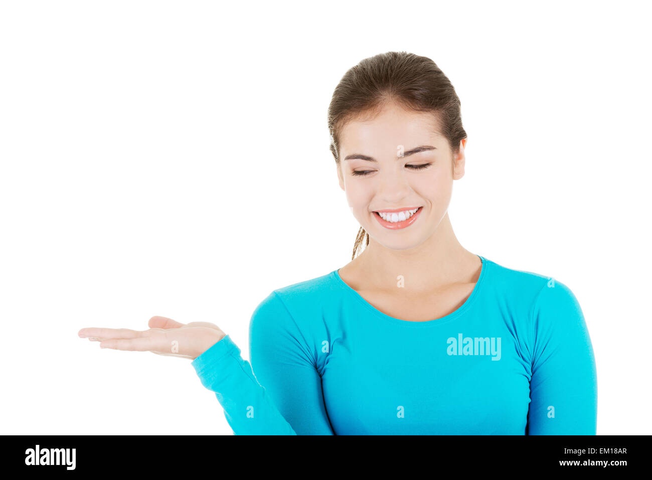 Happy , excited young woman presenting copy space on her palm Stock ...