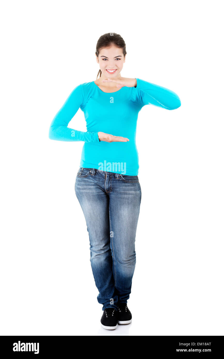 Happy , excited young woman presenting copy space on her palm Stock ...