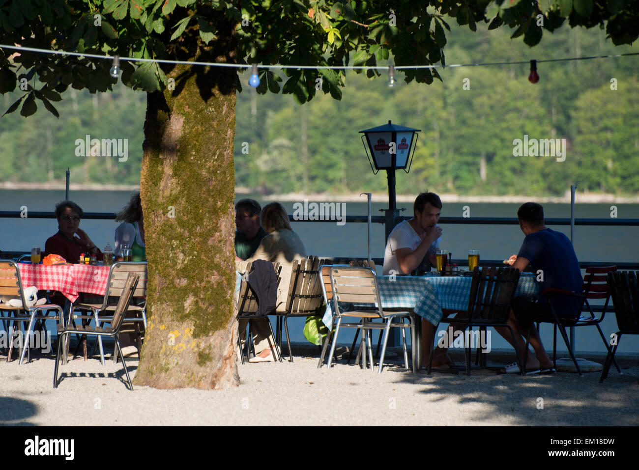 people at the terrace of Gasthof Schraml near lake Grundlsee, Styria, Austria Stock Photo