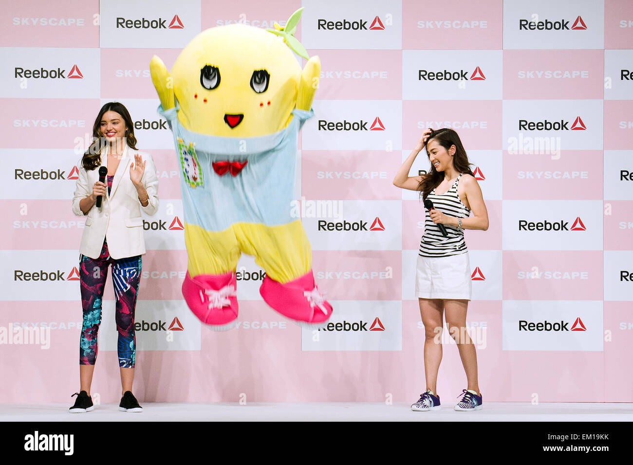 Tokyo, Japan. 15th April, 2015. (L to R) Australian model Miranda Kerr, Japanese mascot character Funassyi and the fashion model Anne Nakamura attend the Reebok Skyscape Fashion Show on April 15, 2015, Tokyo, Japan. Miranda Kerr, who is very popular in Japan, is the Reebok global ambassador for the new footwear line 'Skyscape'. Models Anne Nakamura, Tina Tamashiro and Funassyi, mascot of Funabashi city in Chiba, also attended the event. Credit:  Rodrigo Reyes Marin/AFLO/Alamy Live News Stock Photo