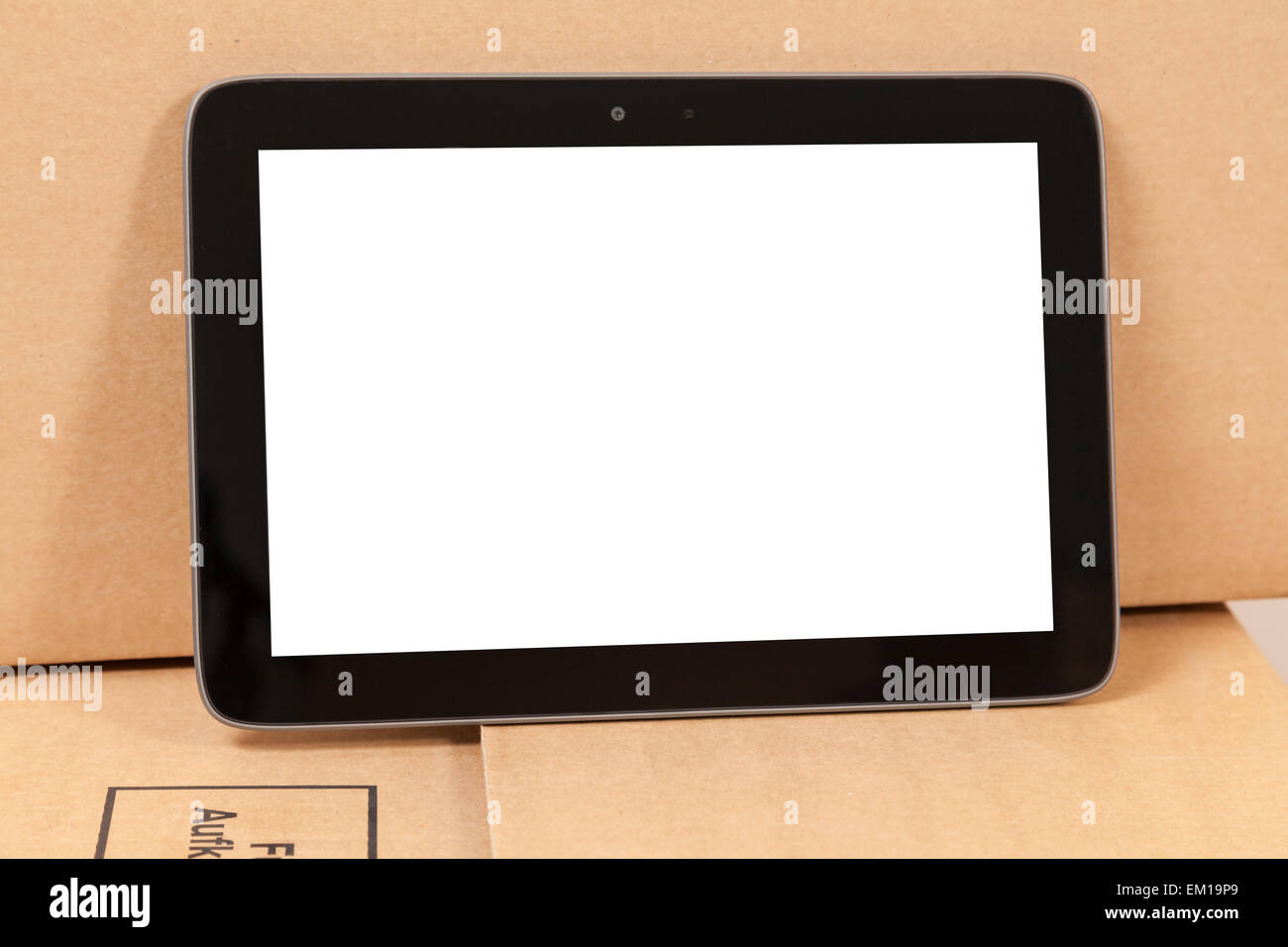 tablet on a moving box Stock Photo