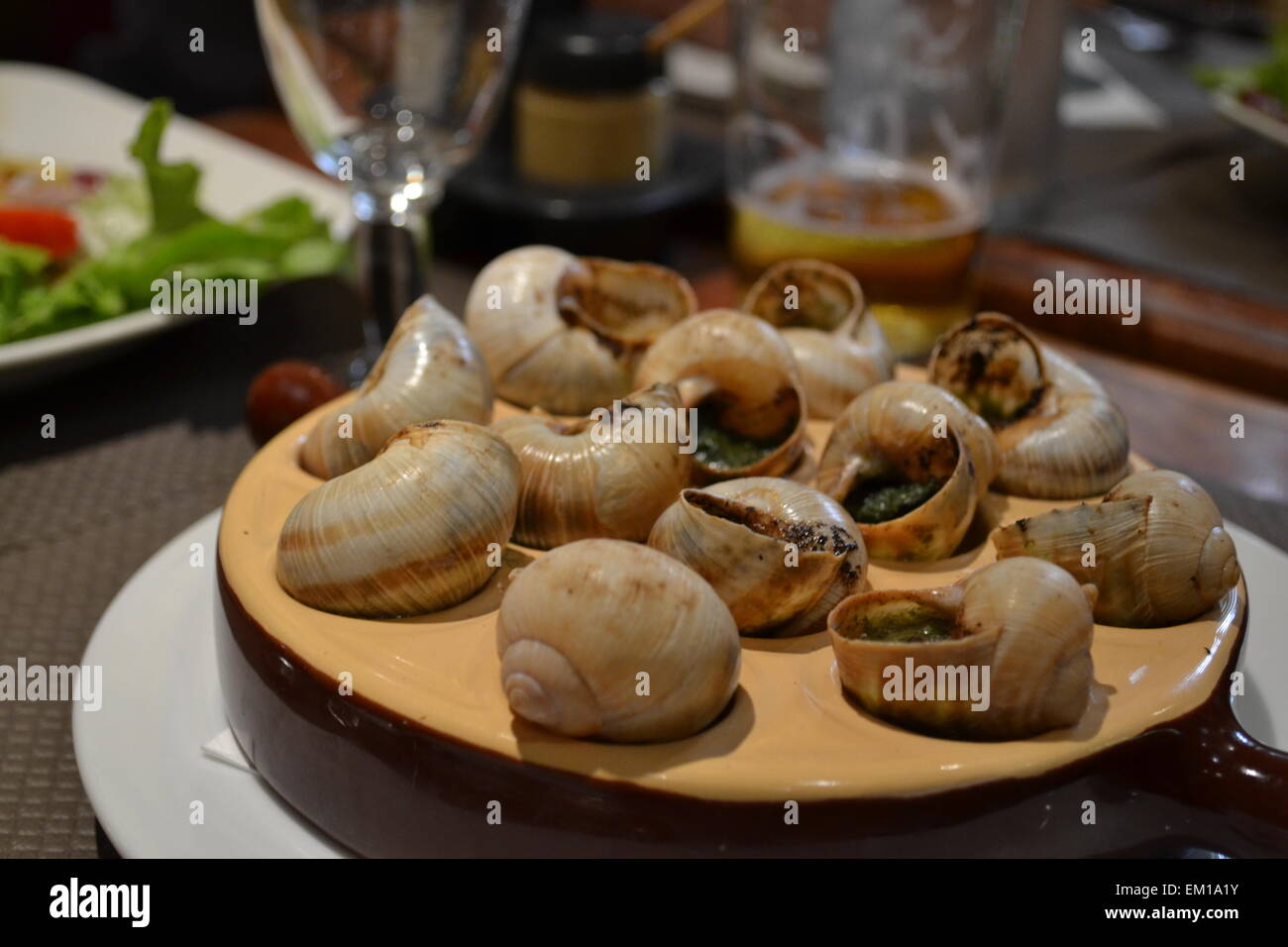 Typical French dish: snails Stock Photo - Alamy