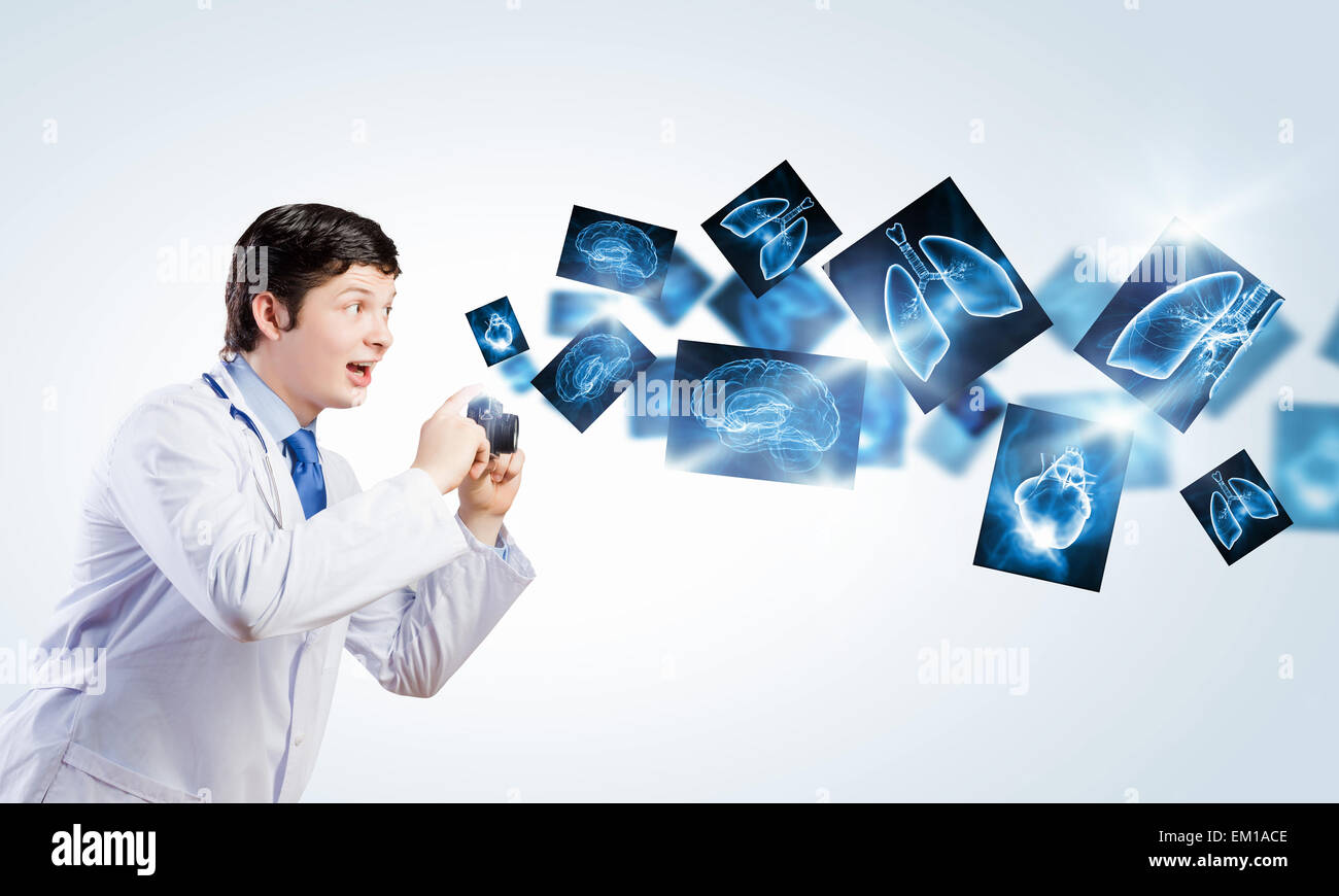 Doctor with photo camera Stock Photo - Alamy