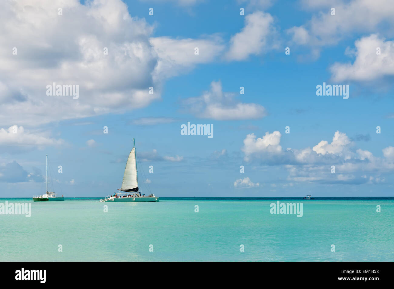 Idyllic and turquoise sea in Palm Beach with boats, Aruba - Antilles, Caribbean. Stock Photo