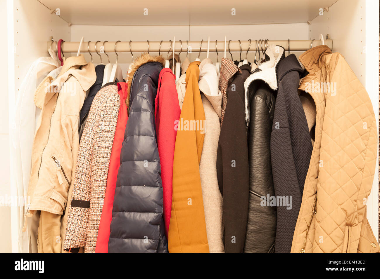 femal wardrobe with winter and summer jackets Stock Photo - Alamy