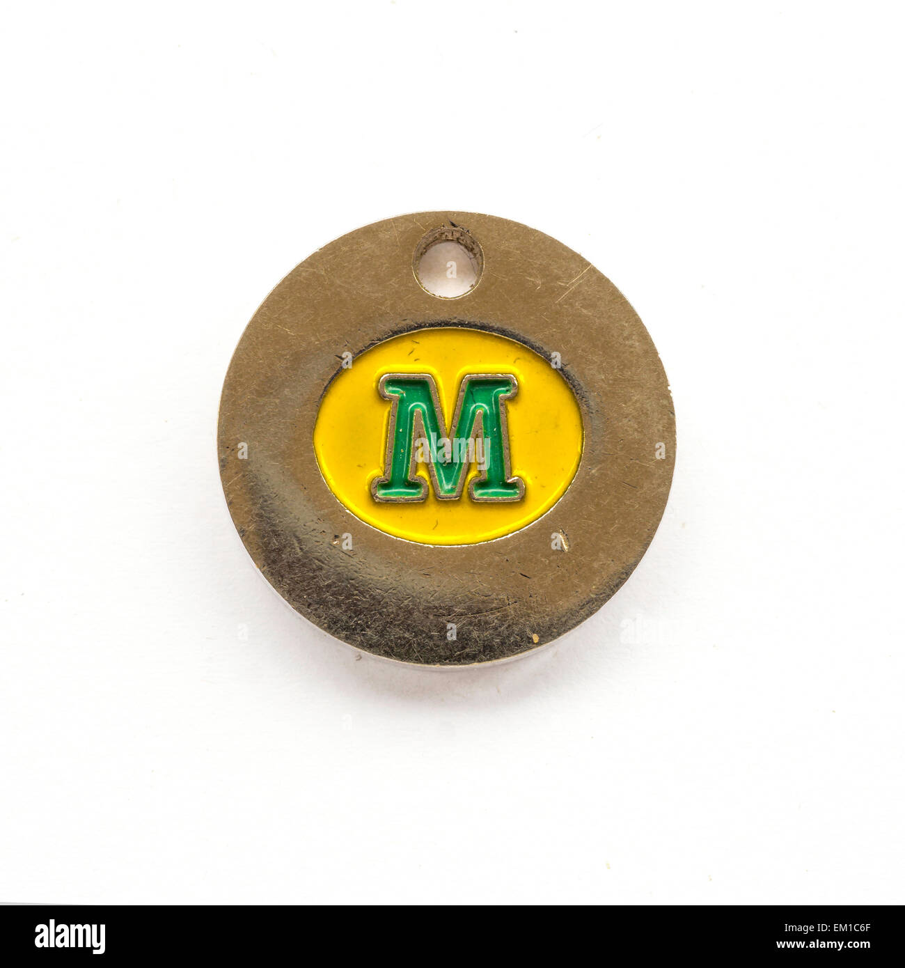 Morrison's Supermarket trolley token given to regular customers to use  in case they do not have a £1 coin Stock Photo