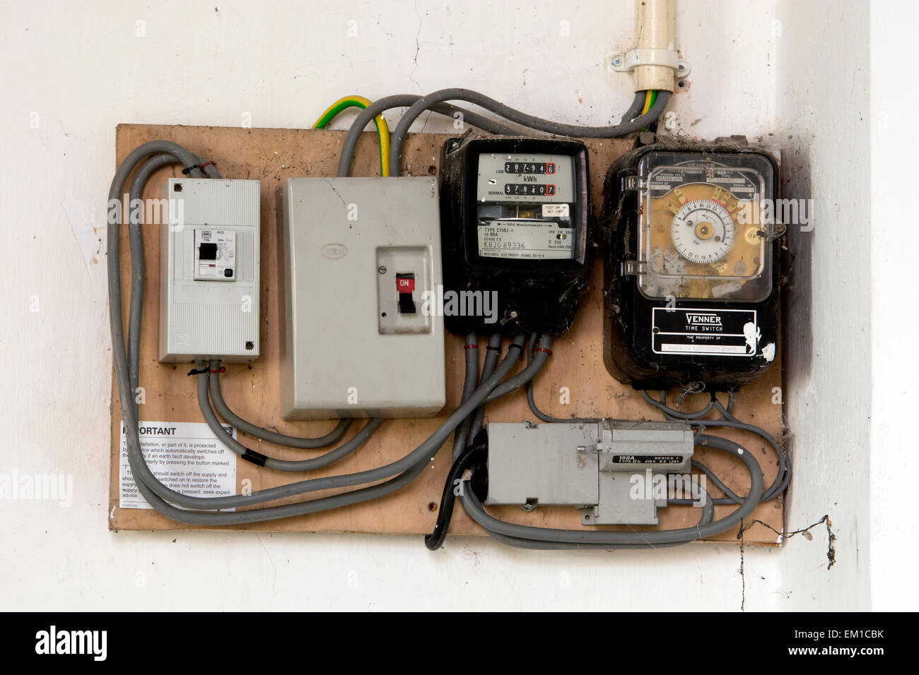 Electricity meters and fuse boxes in a church Stock Photo