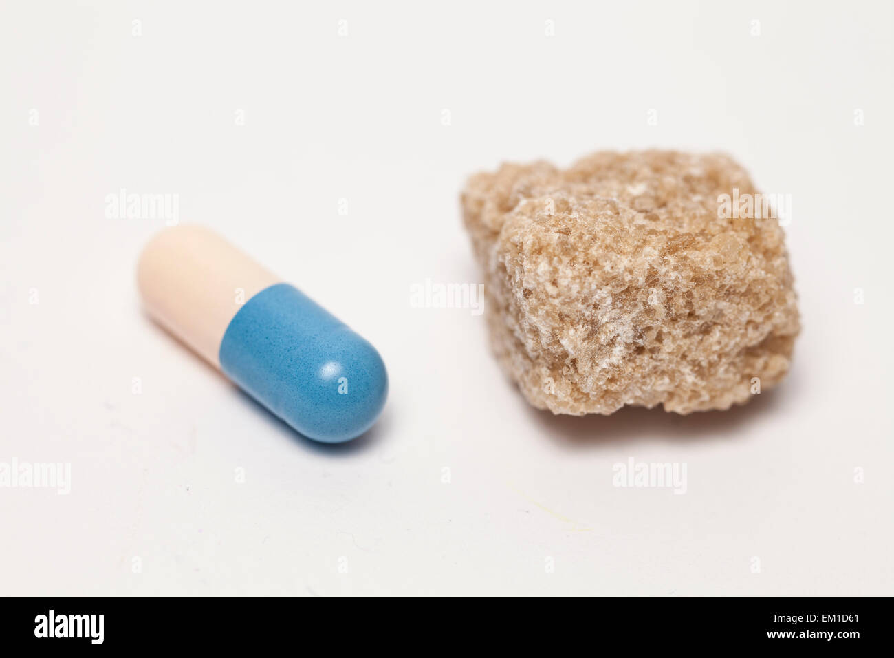 Pill and sugar Stock Photo Alamy