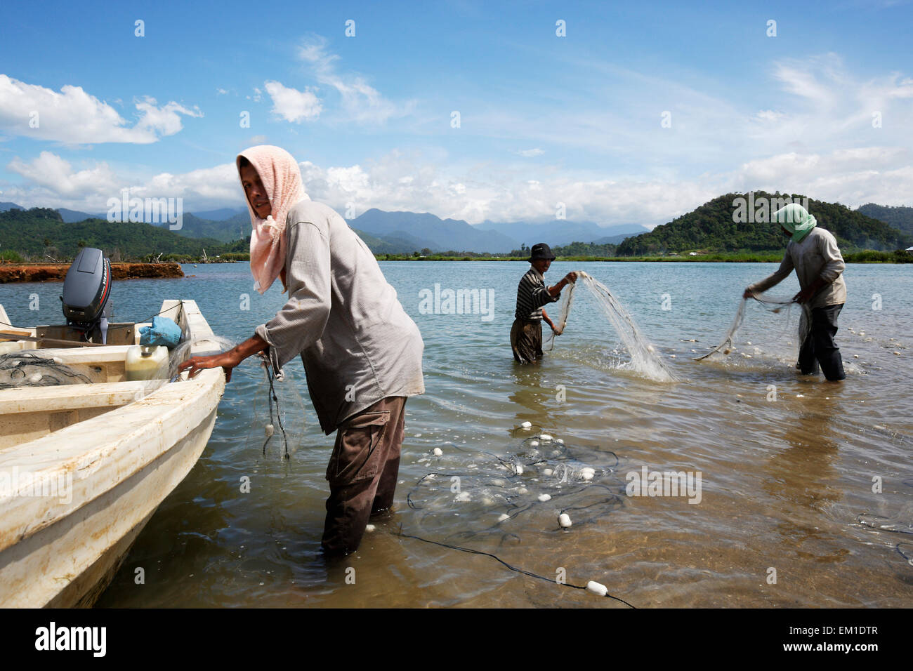Fisher family bringing in the nets near Lamno; Aceh Province, Sumatra, Indonesia Stock Photo