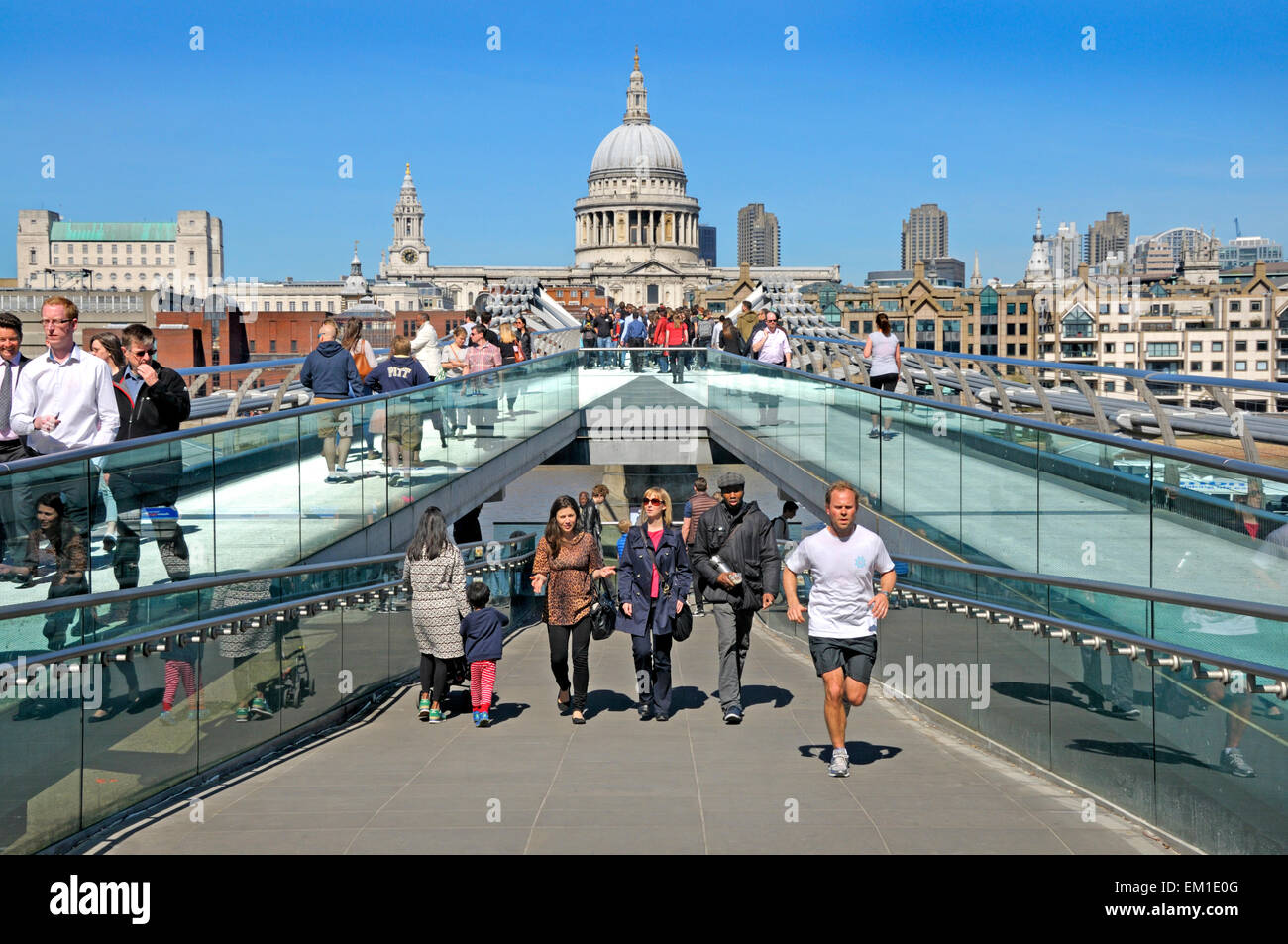 London, England, UK. Millennium Bridge, looking from tate Modern across the Thames to St Paul's Cathedral Stock Photo