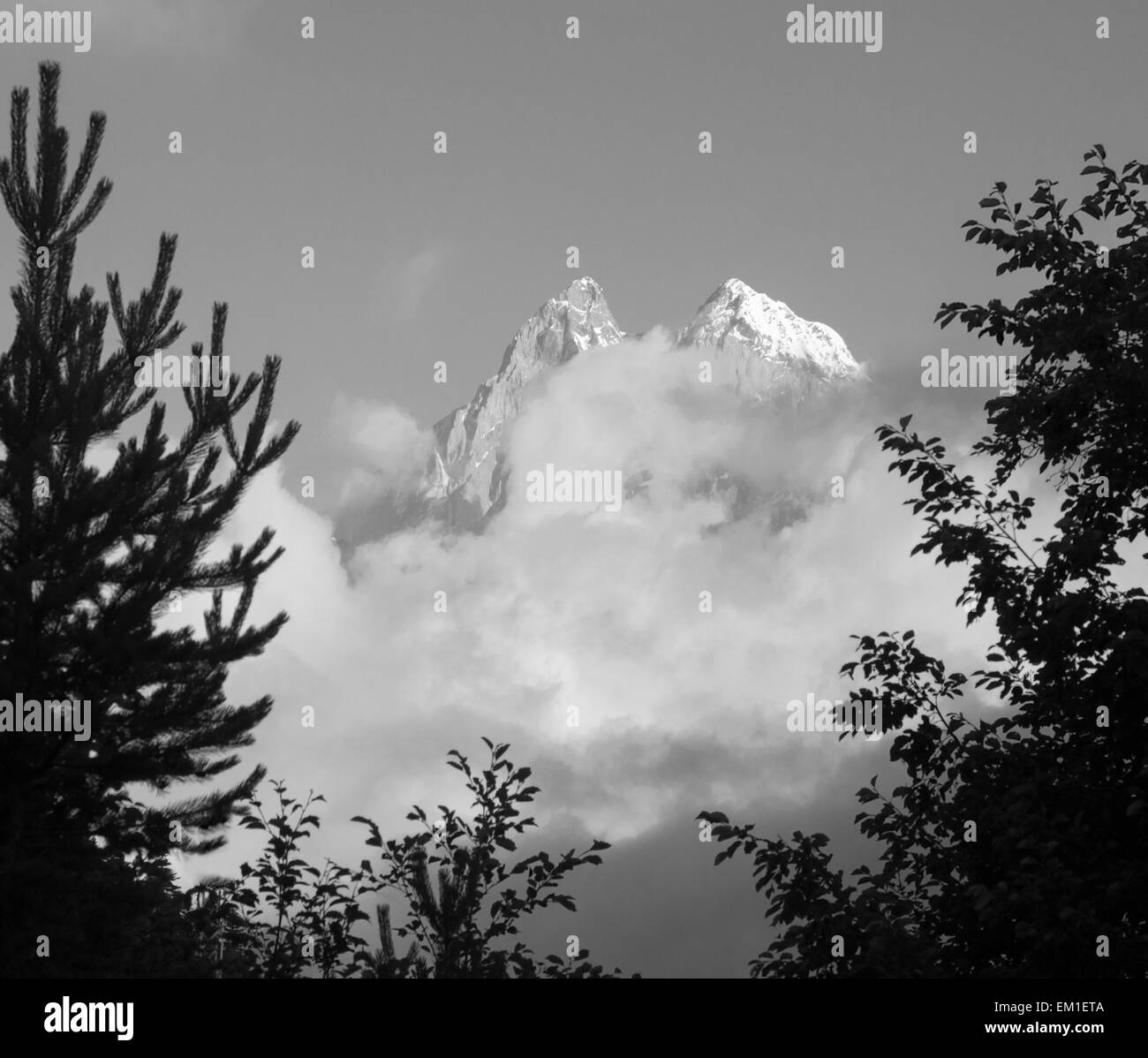 Ushba  from the outskirts of Mestia. Black-and-white image of famous peak. Place - Caucasus Mountains, Georgia. Stock Photo