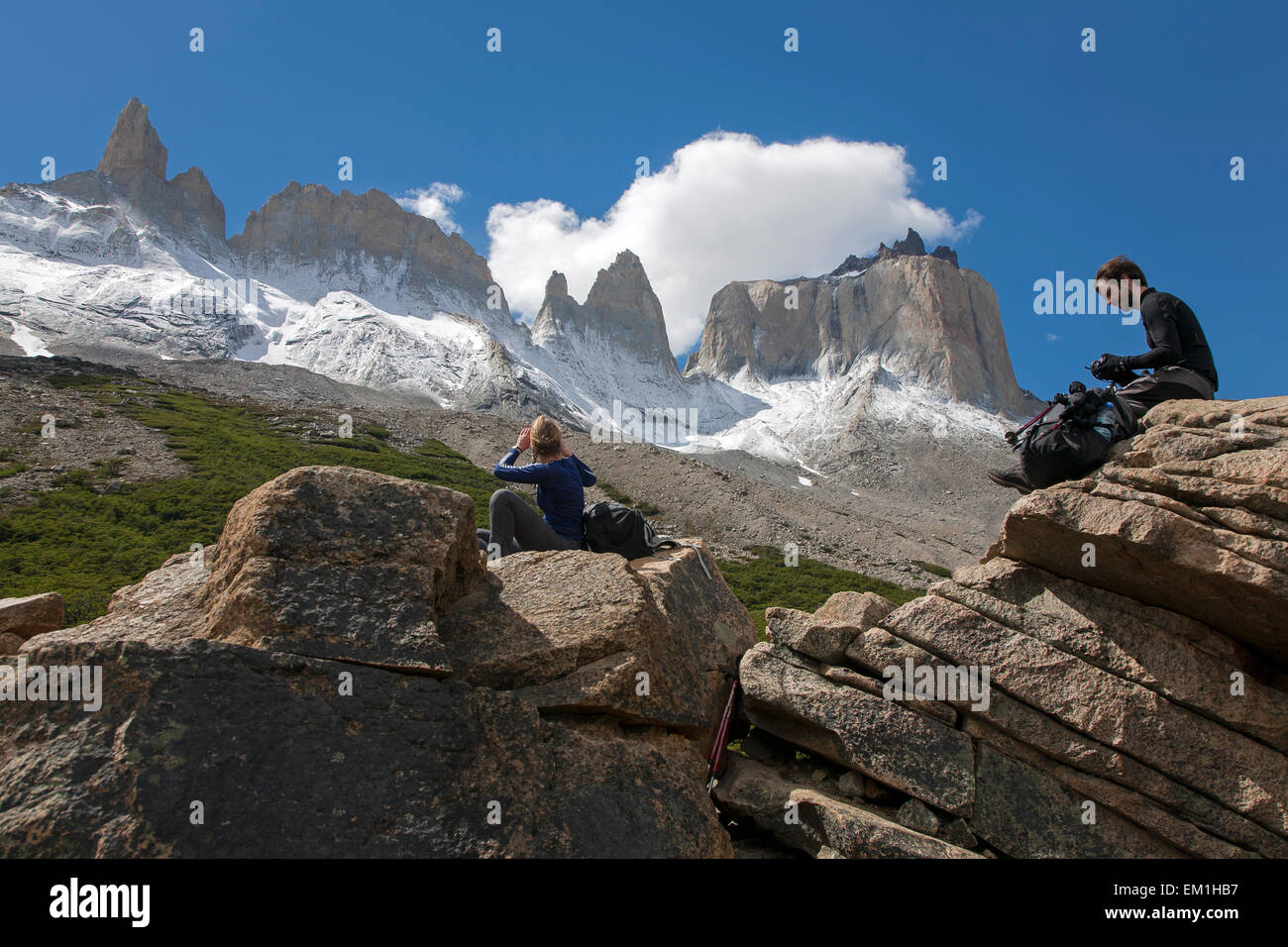 Backpackers contemplating the Horns of Paine. French Valley. Torres del Paine National Park. Patagonia. Chile Stock Photo