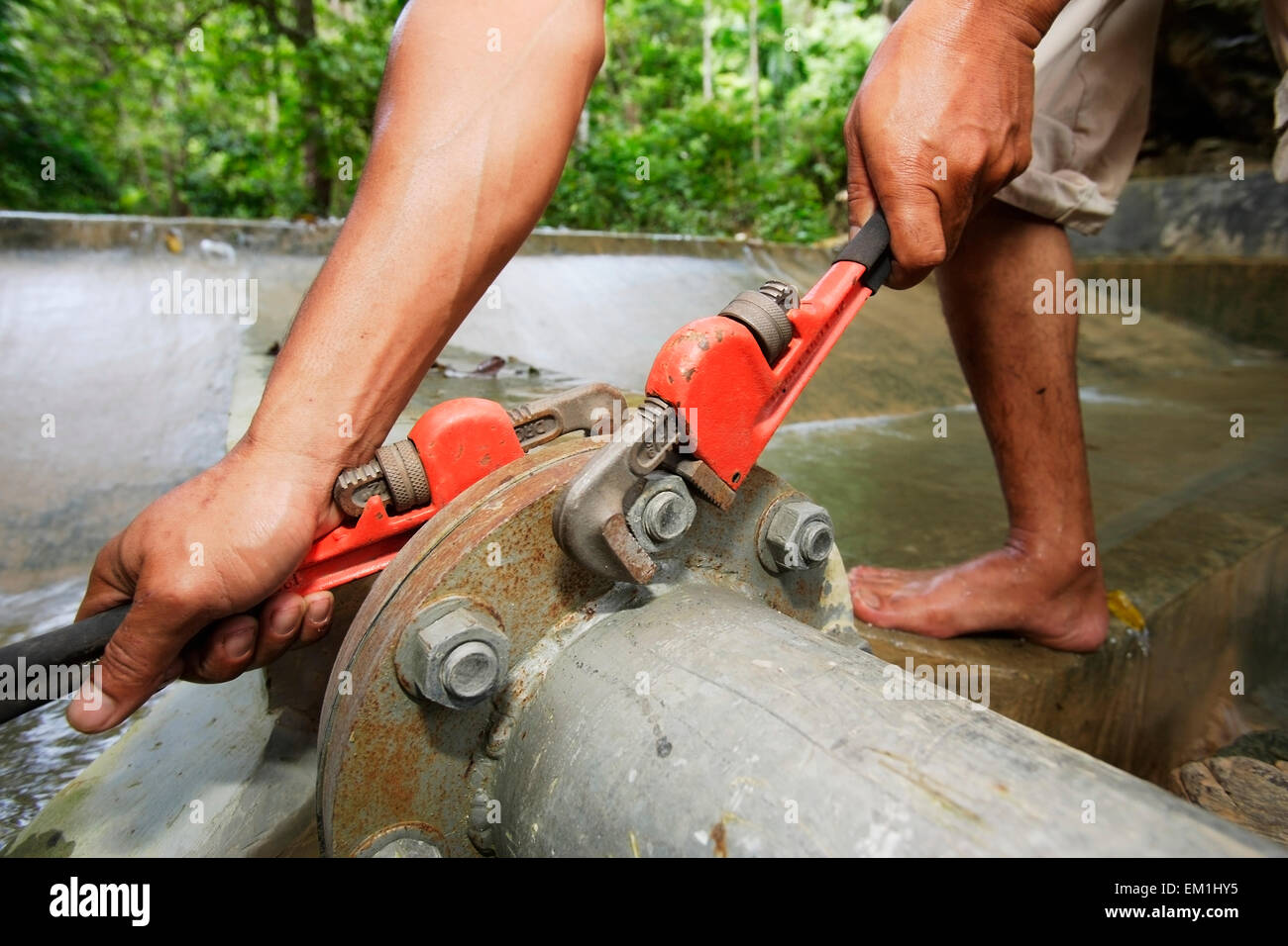 Repairing a water main pipe; Banda Aceh, Aceh Province, Sumatra, Indonesia Stock Photo