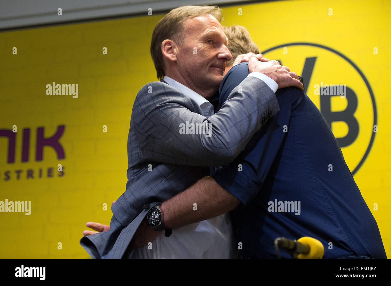 Dortmund, Germany. 15th Apr, 2015. Juergen Klopp (R), head coach of German Bundesliga soccer team Borussia Dortmund, and Borussia Dortmund's General Manager Hans-Joachim Watzke (L) hug during a press conference at Signal Iduna Park in Dortmund, Germany, 15 April 2015. The club has agreed to Klopp's request for an early release from his contract after this season, a representative for the club said today. PHOTO: FEDERICO GAMBARINI/dpa/Alamy Live News Stock Photo