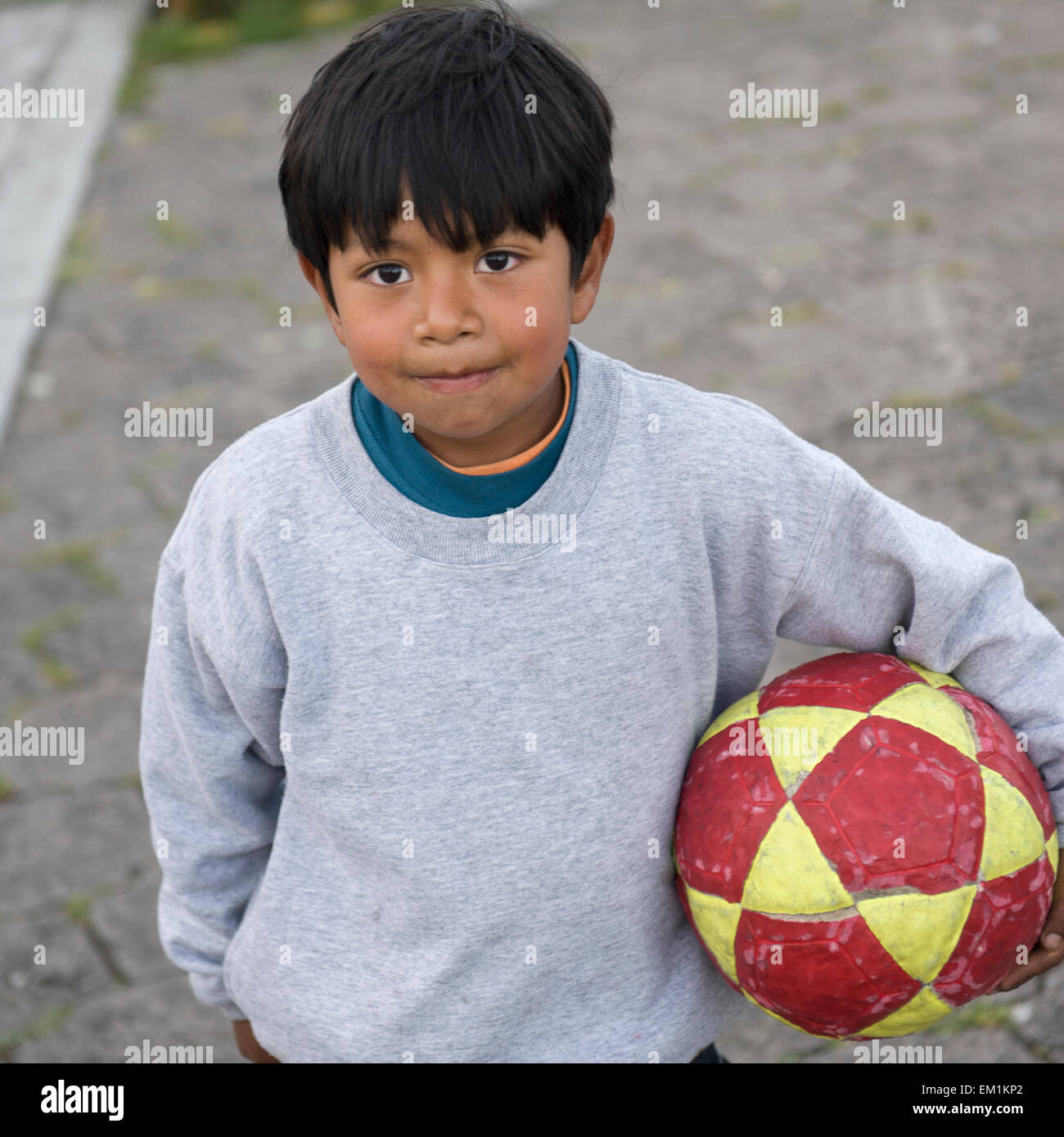 A Boy Holds A Soccer Ball; Quito Equador Stock Photo