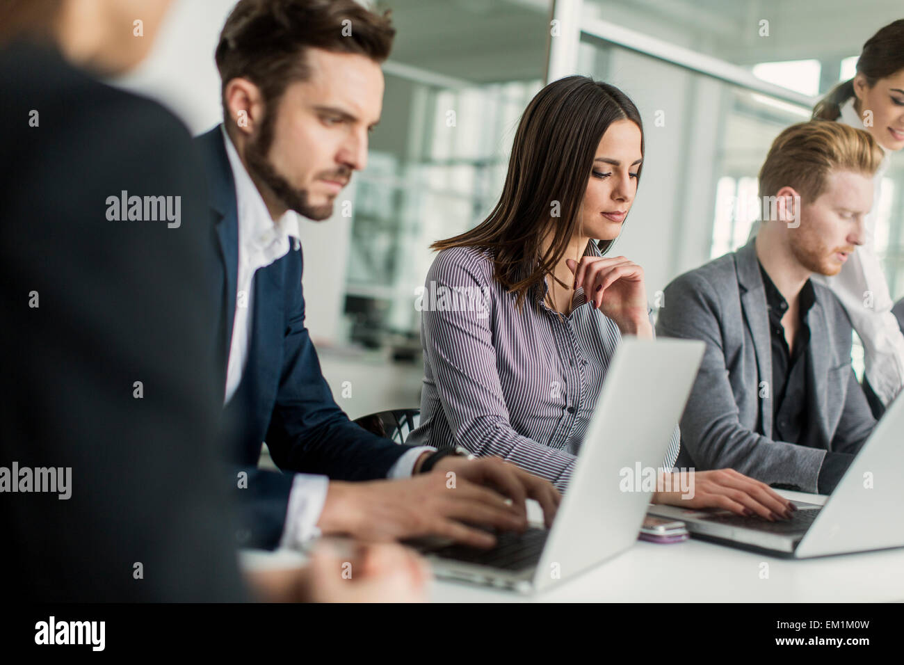 Young people in the office Stock Photo - Alamy