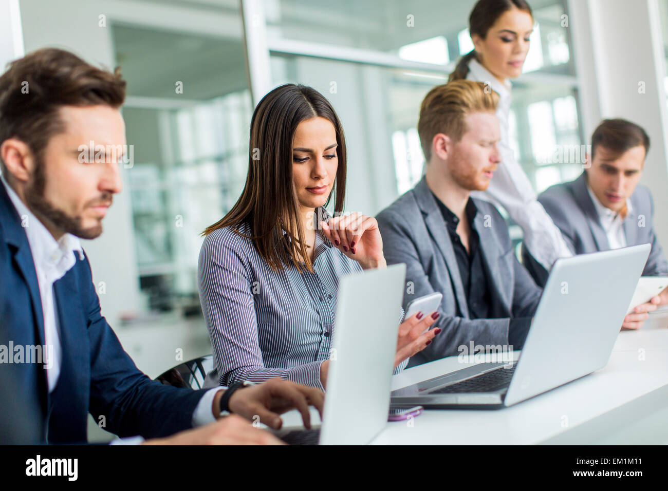 Young people in the office Stock Photo - Alamy