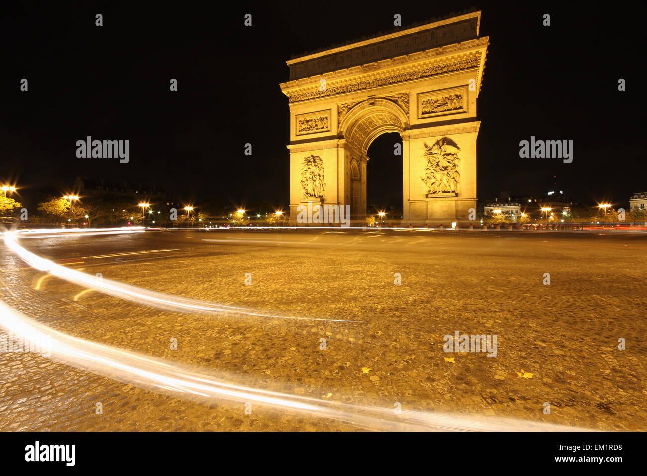 Traffic Light Trails Around The Arc De Triomphe; Paris France Stock Photo