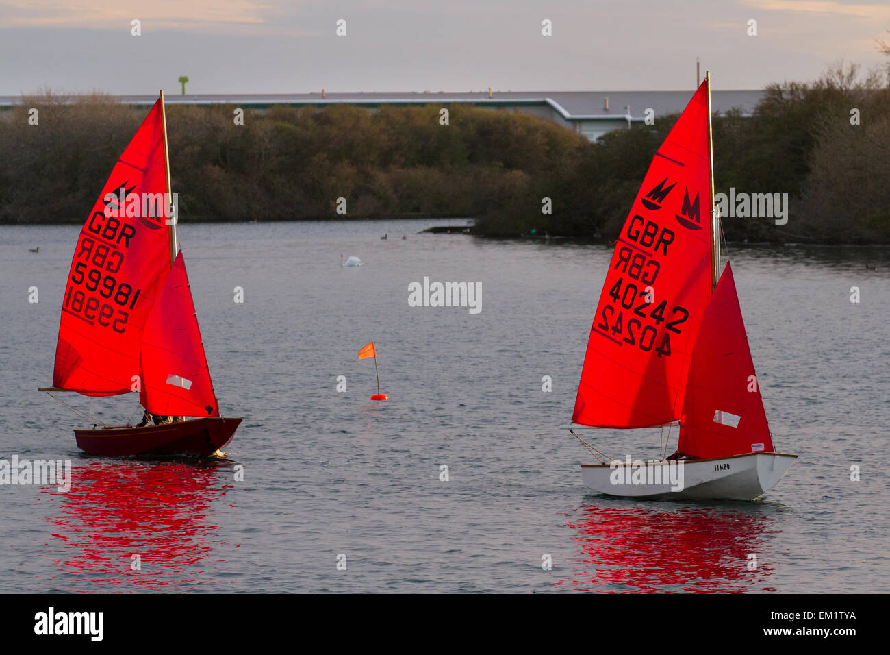 Southport, Merseyside, UK 15th April, 2015. UK Weather. 'Ladies who Launch' Sunset evening Sail. West Lancashire Yacht Club members sailing in Marine Lake regatta at dusk. The West Lancashire Yacht Club (WLYC) is a yacht club in Merseyside, England, founded in 1894. I Stock Photo