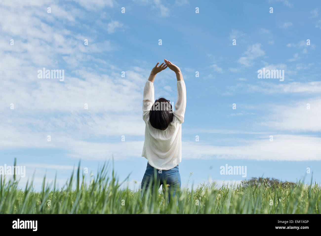 Woman arms up green hi-res stock photography and images - Alamy