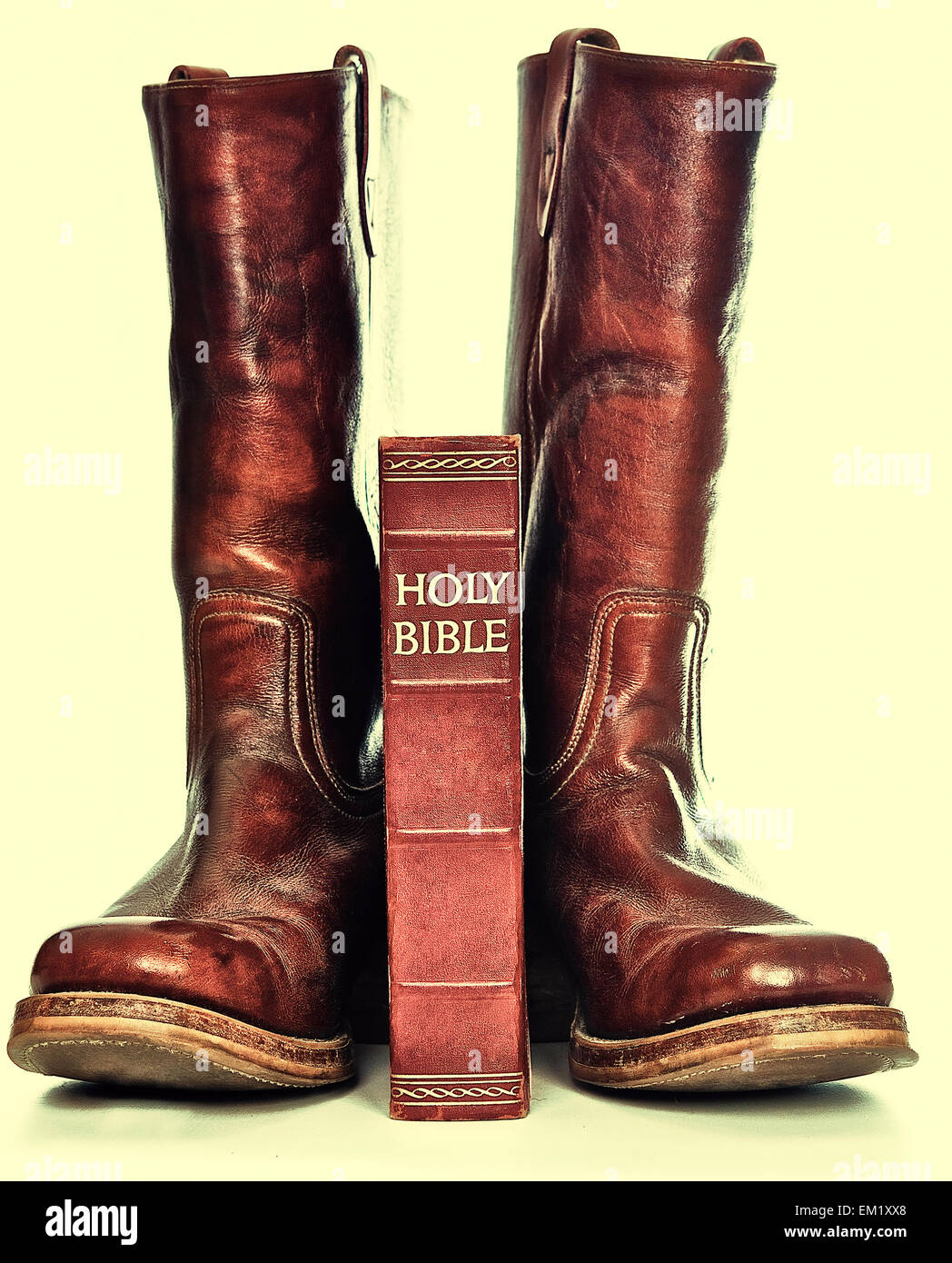 Rugged cowboy boots and bible Stock Photo Alamy