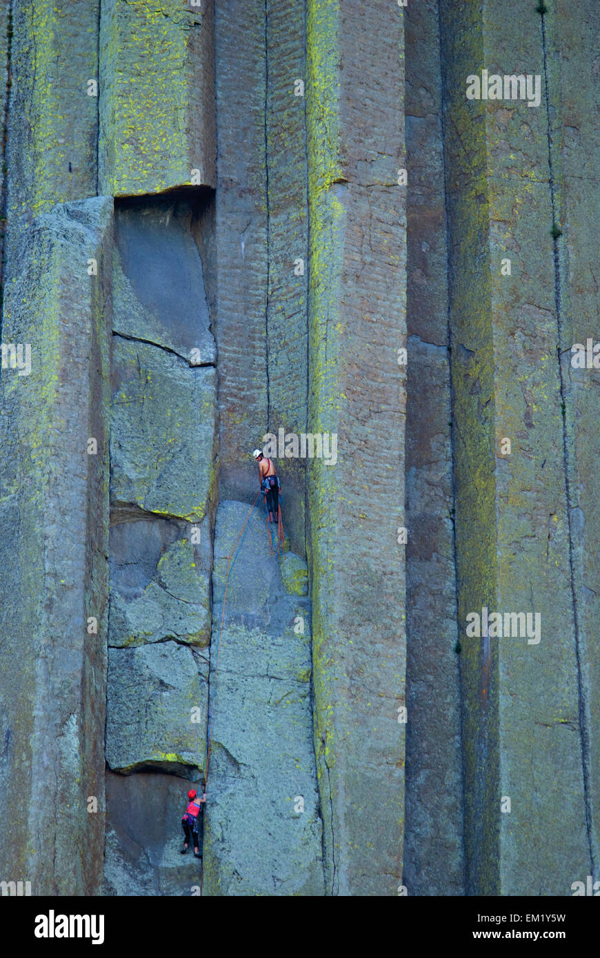 Climbers On The Colorful Wall Of Devils Tower National Monument; Wyoming United States Of America Stock Photo
