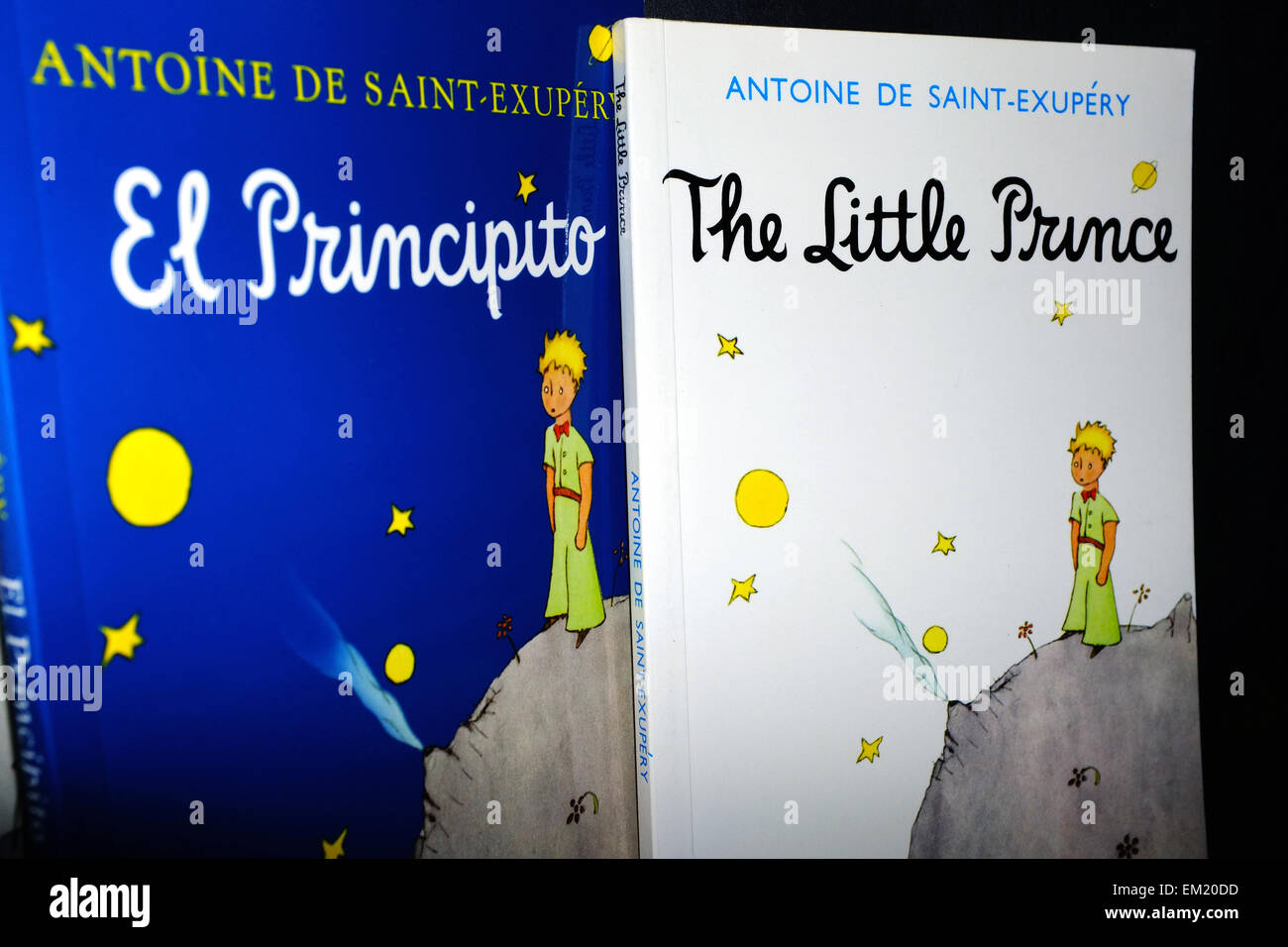 The front cover of The Little Prince in English and Spanish book photographed against a black background. Stock Photo
