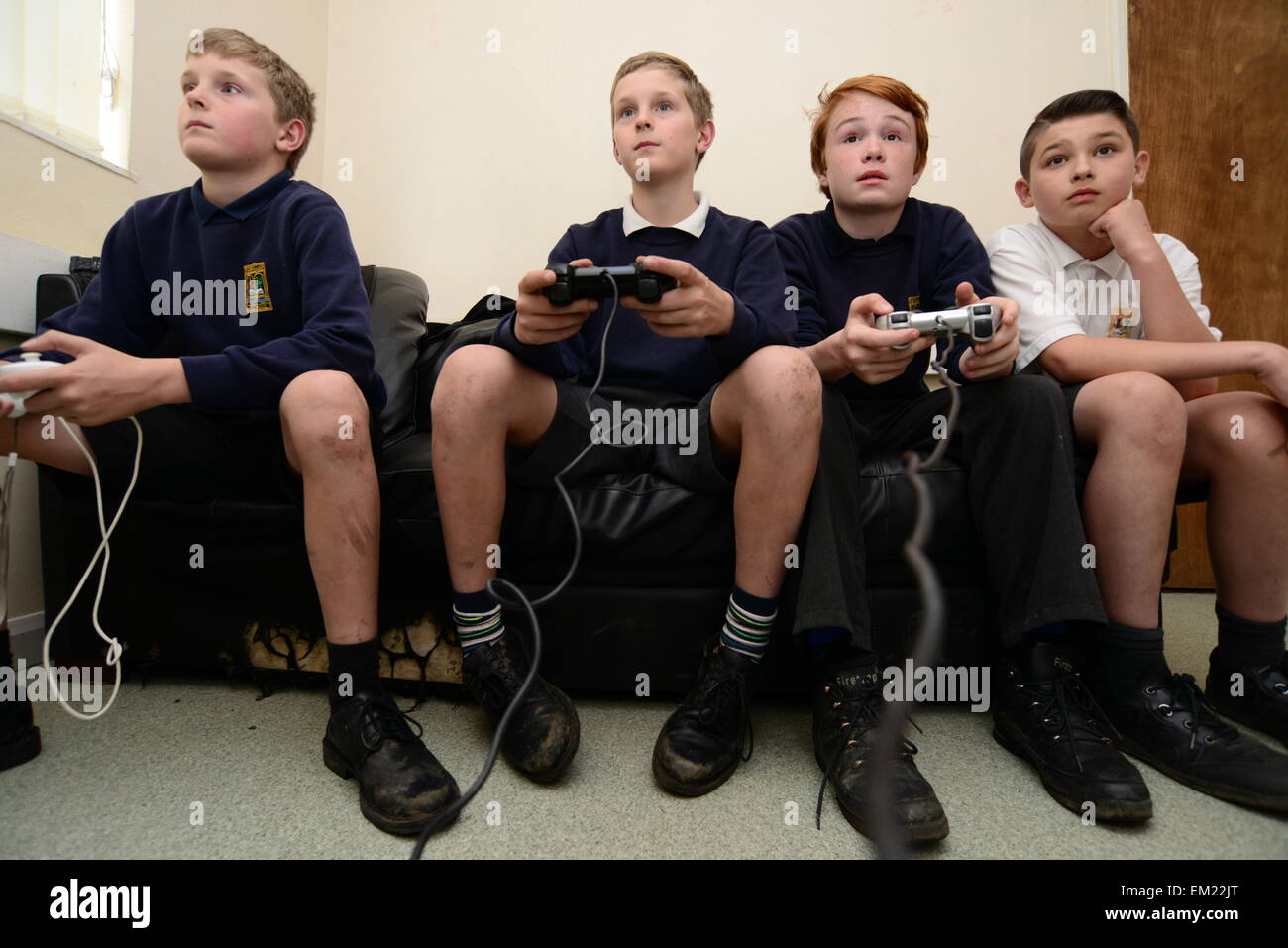 Young boys playing on a Sony Playstation. Picture: Scott Bairstow/Alamy Stock Photo