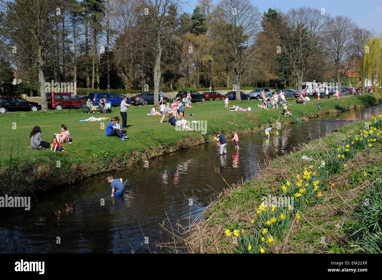 Families paddling and fishing in The River Leven in Great Ayton, North ...