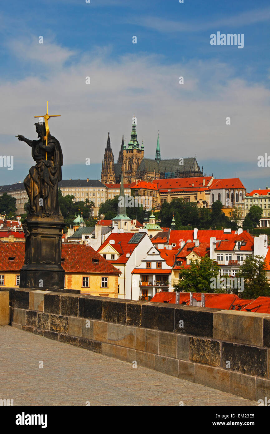 Statue On Charles Bridge With Royal Palace In The Background; Prague Czech Republic Stock Photo