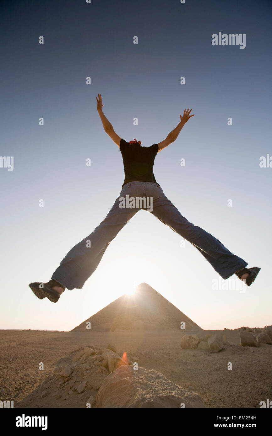 Woman back camera jumps hi-res stock photography and images - Alamy
