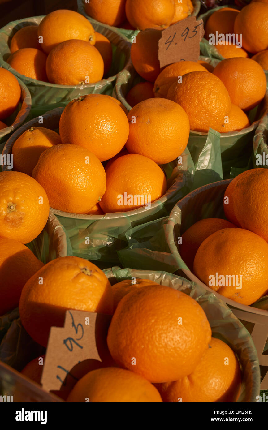 Baskets of oranges for sale at an outdoor market, Wakefield, PA, USA Stock Photo